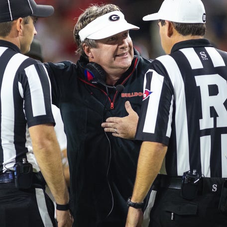 Georgia coach Kirby Smart talks with the referees during the fourth quarter against Alabama at Bryant-Denny Stadium.