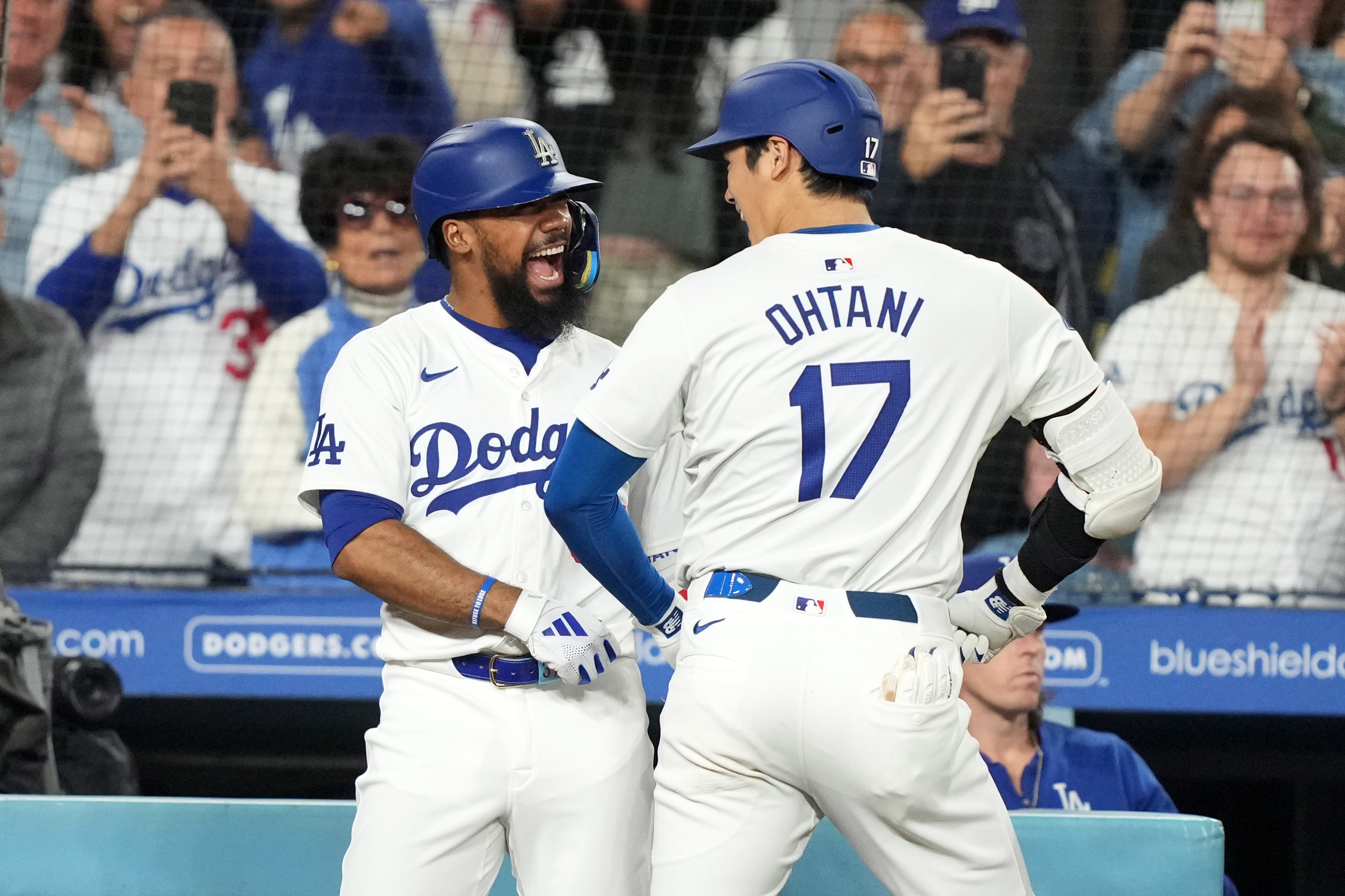 Shohei Ohtani celebrates a home run with Teoscar Hernandez.