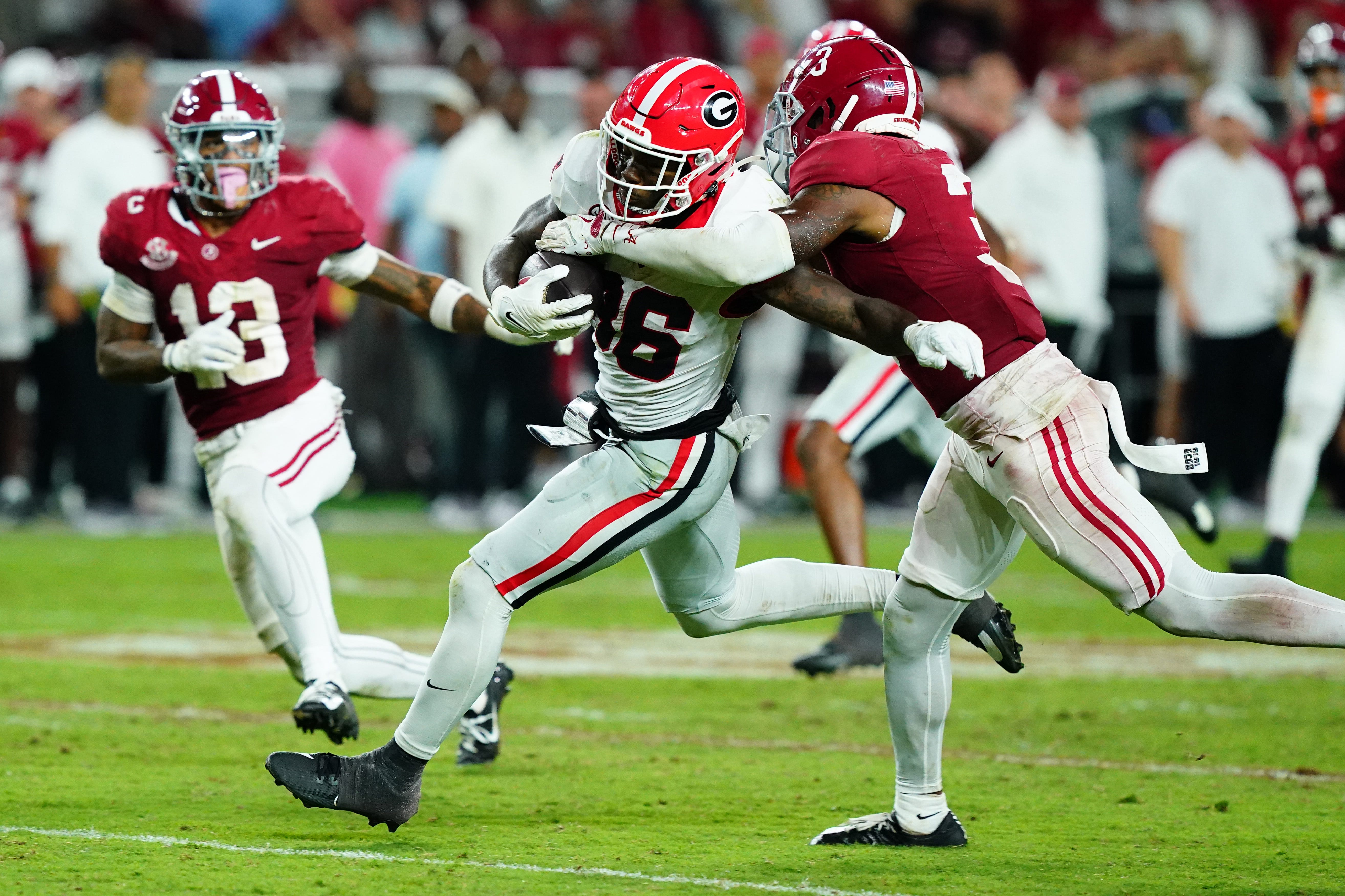 Georgia wide receiver Dillon Bell (86) fights off the tackle of Alabama defensive back Keon Sabb (3) during the fourth quarter at Bryant-Denny Stadium.