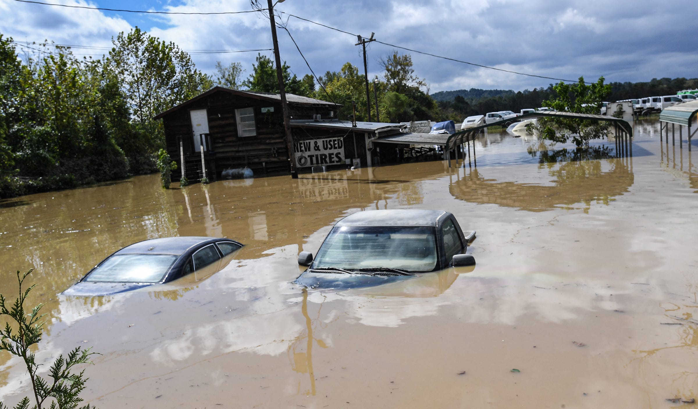 Cars in a flooded area at a used tire dealer along Business Highway 25 after Hurricane Helene in Hendersonville, N.C. Saturday, September 27, 2024. ORG XMIT: Tropical Storm Helene (Via OlyDrop)