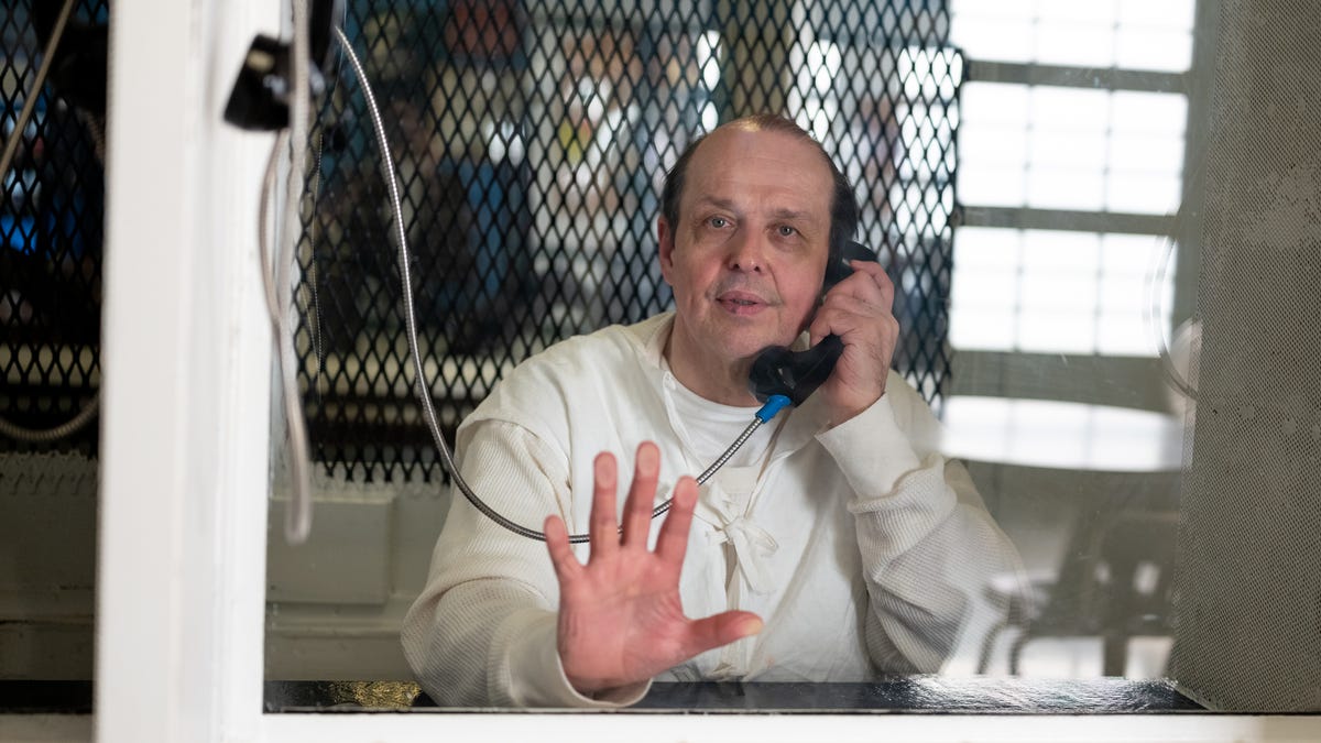 Robert Roberson photographed through plexiglass at TDCJ Polunsky Unit.