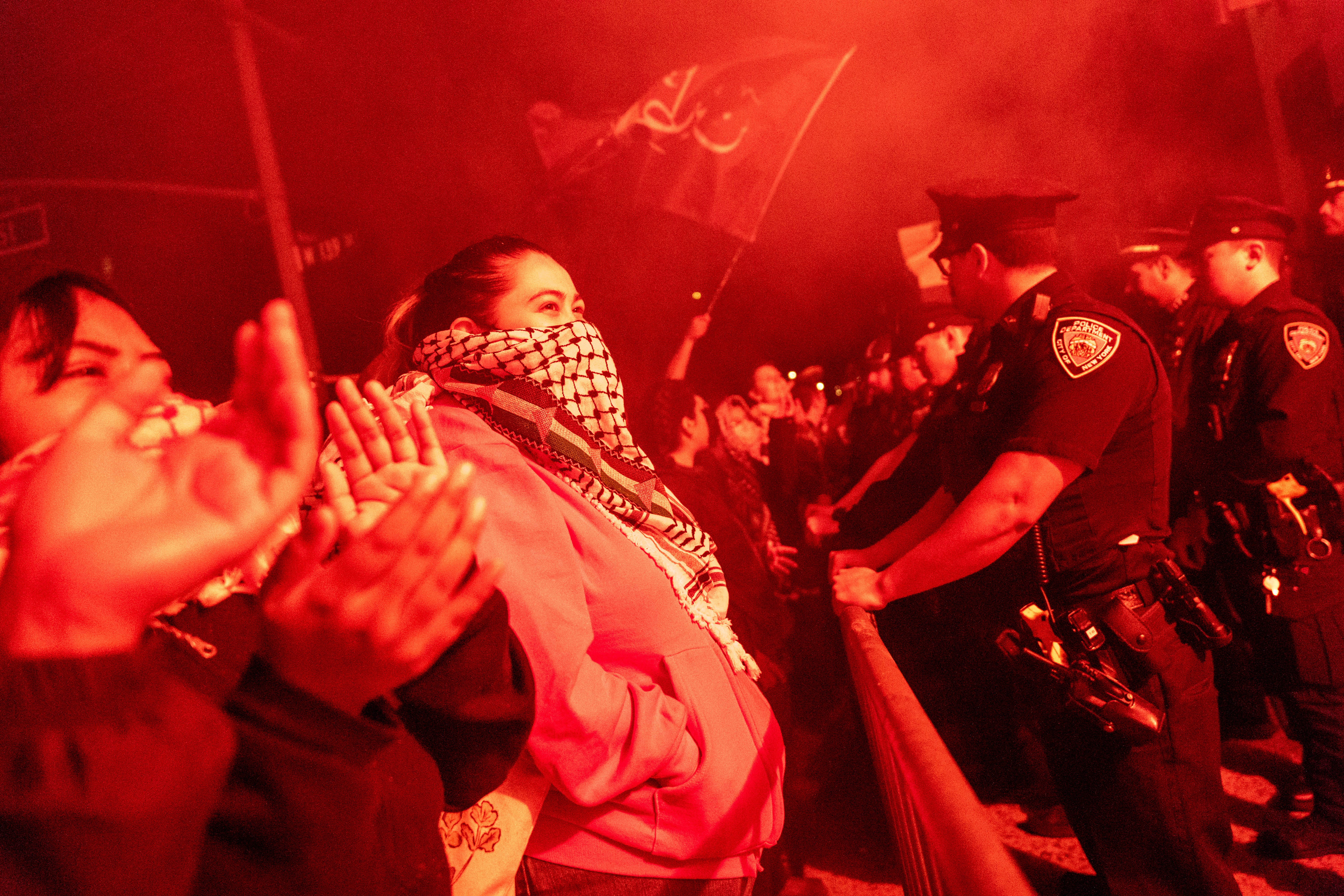 Pro-Palestinian supporters confront police during demonstrations at The City College Of New York (CUNY) as the NYPD cracks down on protest camps at both Columbia University and CCNY on April 30, 2024 in New York City. A heavy police presence surrounded both campuses on Tuesday as local law enforcement attempts to bring an end to pro-Palestinian protest encampments. Classes at both schools have been moved virtually to online learning in response to the recent campus   unrest.