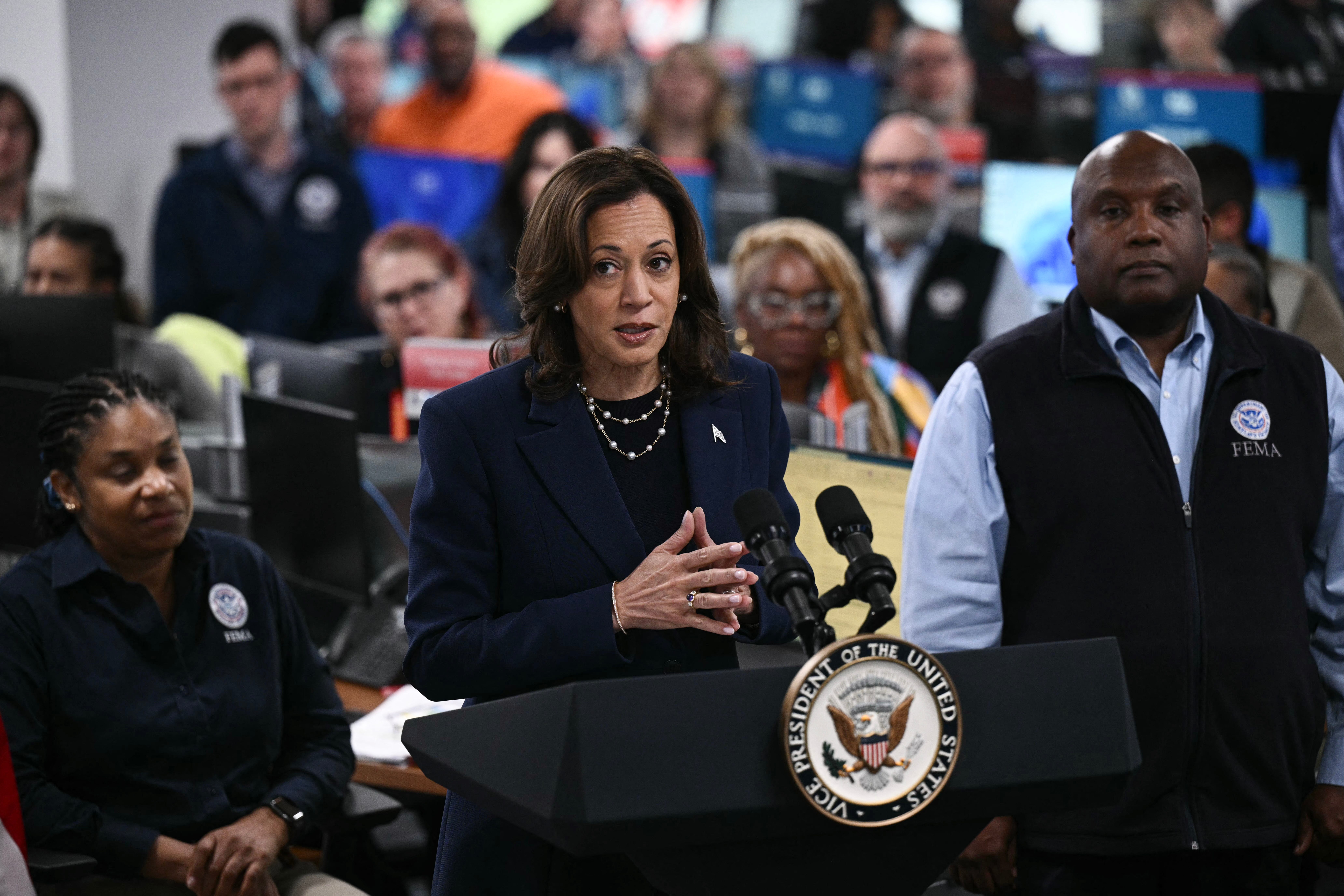 Democratic presidential candidate Kamala Harris speaks alongside Erik Hooks, FEMA Deputy Administrator, before attending a briefing about the impacts of Hurricane Helene and updates on the federal response