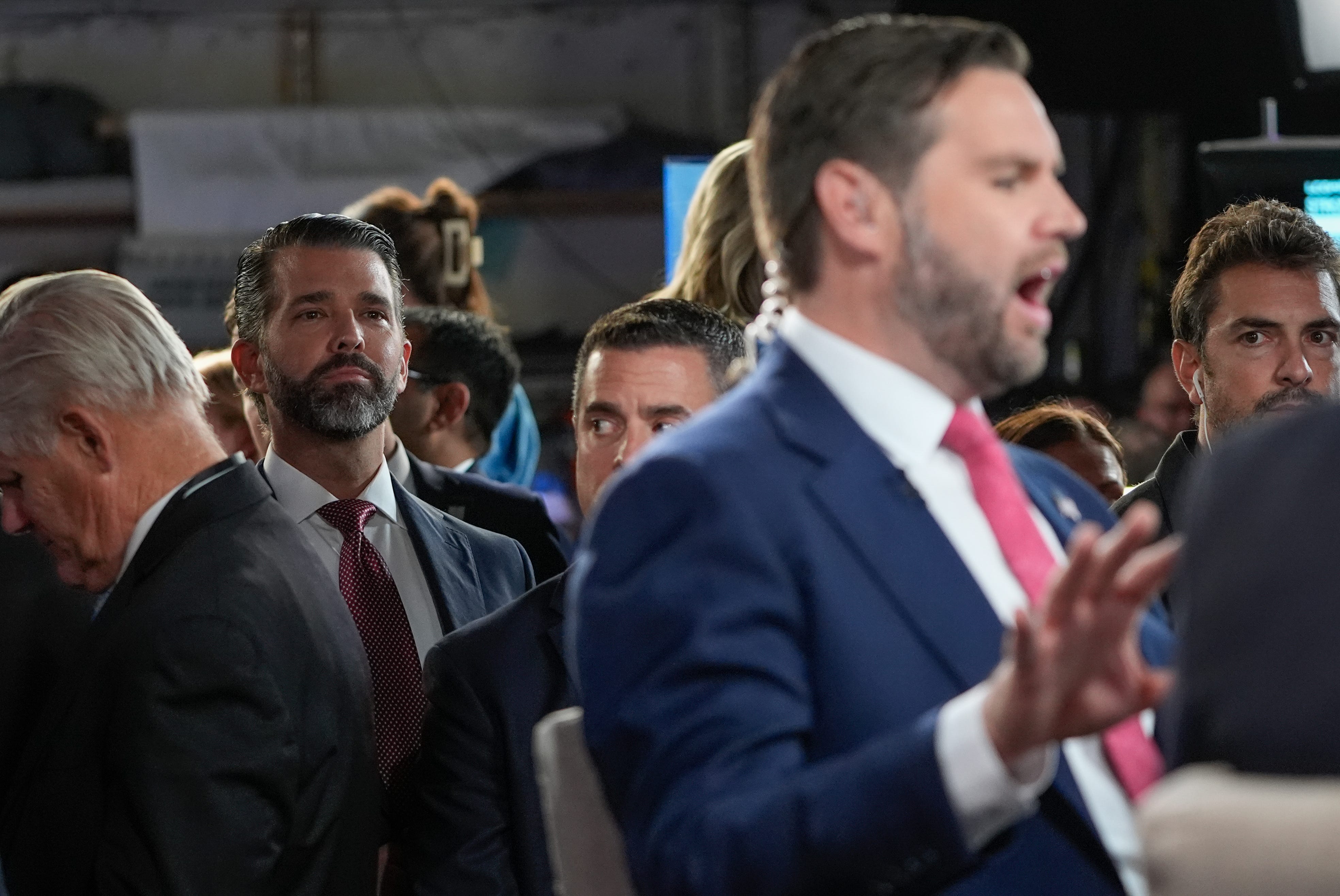 Donald Trump Jr. listens as Republican JD Vance speaks to Sean Hannity in The Spin Room after the vice presidential debate with Democrat Tim Walz moderated by CBS Evening News anchor and managing editor Norah O'Donnell and Face the Nation moderator and chief foreign affairs correspondent Margaret Brennan.