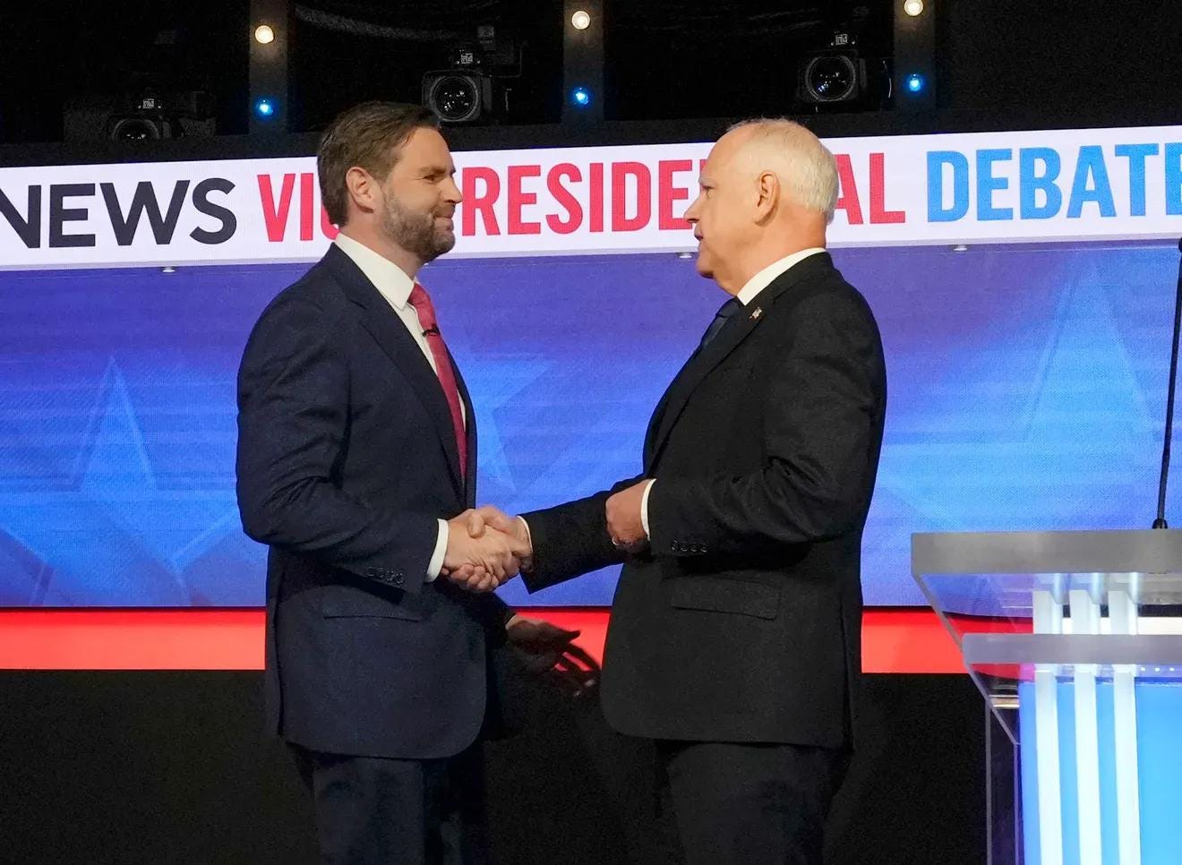Ohio Sen. JD Vance, left, and Minnesota Gov. Tim Walz start their vice presidential debate Oct. 1 with a handshake.