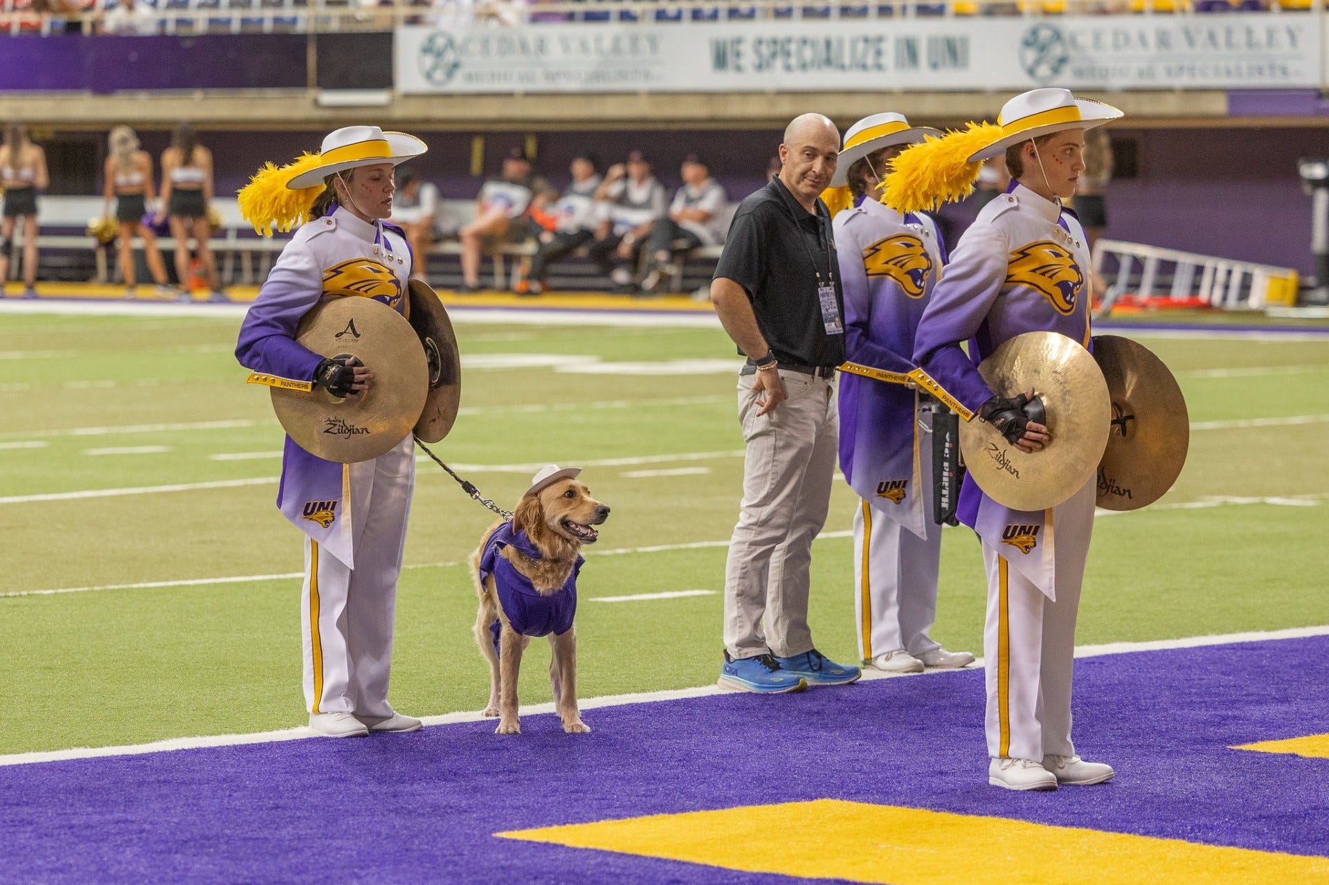 Gabi Riessen and her service dog, Winnie, take to the field for marching band.