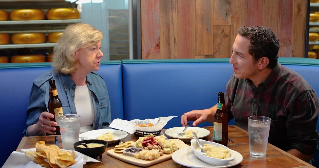 Longtime Alaska Republican Sen. Lisa Murkowski, left, dines on salmon, scallops and some beer with "Breaking Bread with Alexander" host Alexander Heffner at Chena Hot Springs, near Fairbanks, Alaska, as they record an episode of Heffner's show.