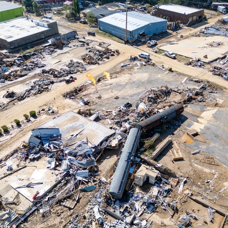 Debris litters the surrounding area of the Swannanoa River during the aftermath of flooding caused by Tropical Storm Helene in Asheville on Oct. 6, 2024.