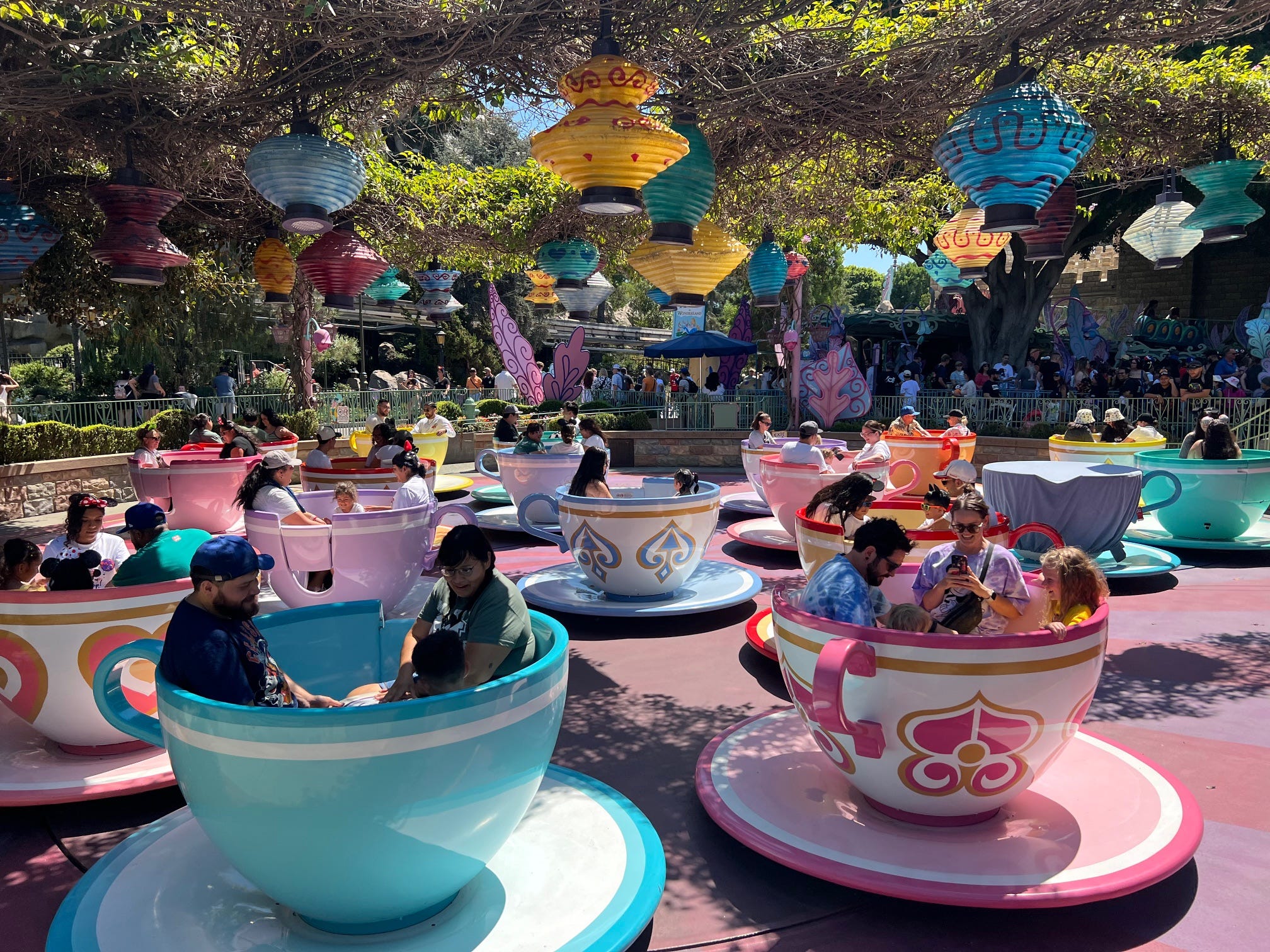 Guests giggle and spin on Disneyland's Mad Tea Party.