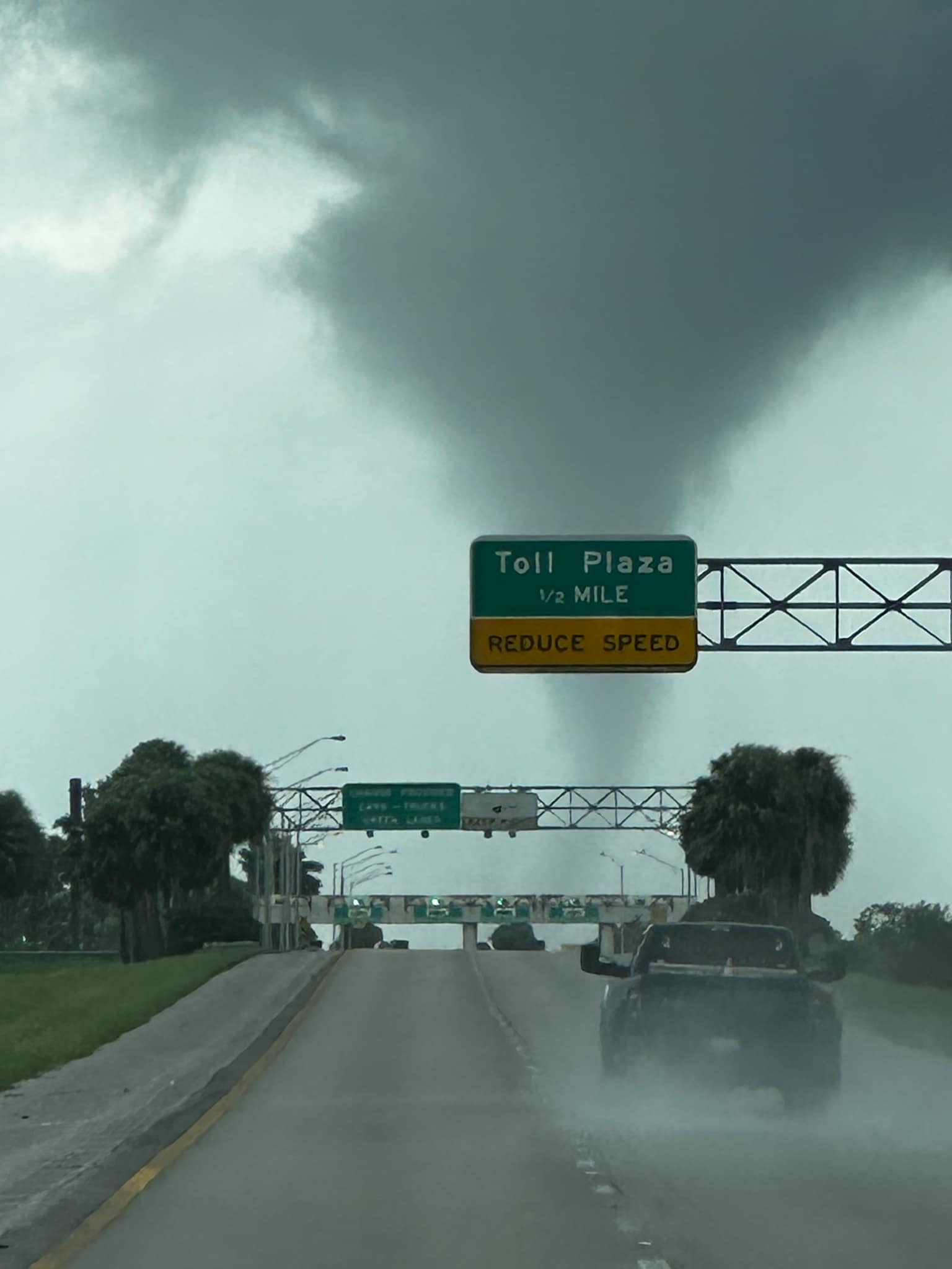 A tornado forms along I-75 heading north from Fort Lauderdale, Florida on Oct. 9, 2024. The National Weather Service in Miami reports they have confirmed four tornadoes in South Florida, and have received two other reports.