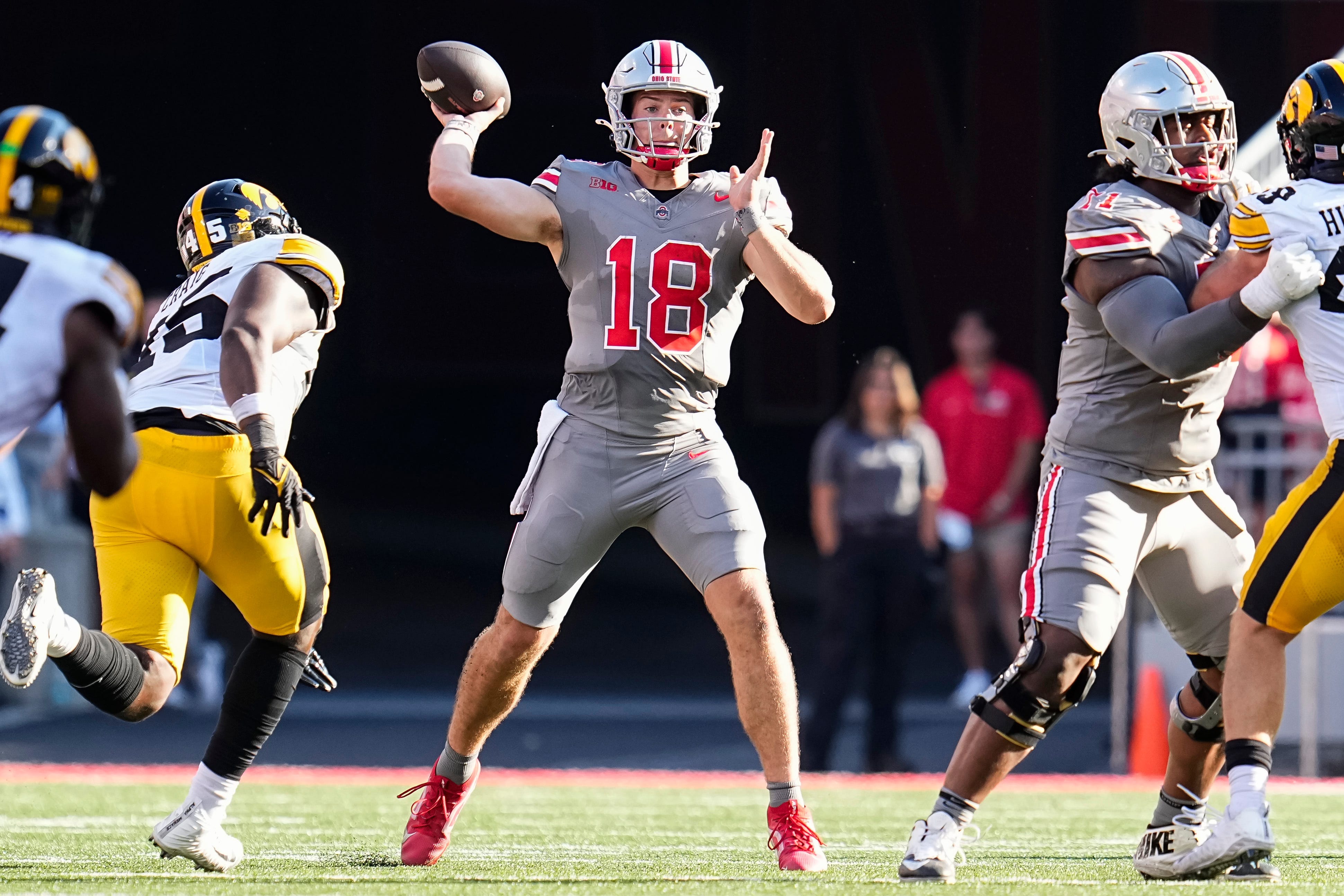 Ohio State quarterback Will Howard (18) looks to throw during his team's game against Iowa at Ohio Stadium.