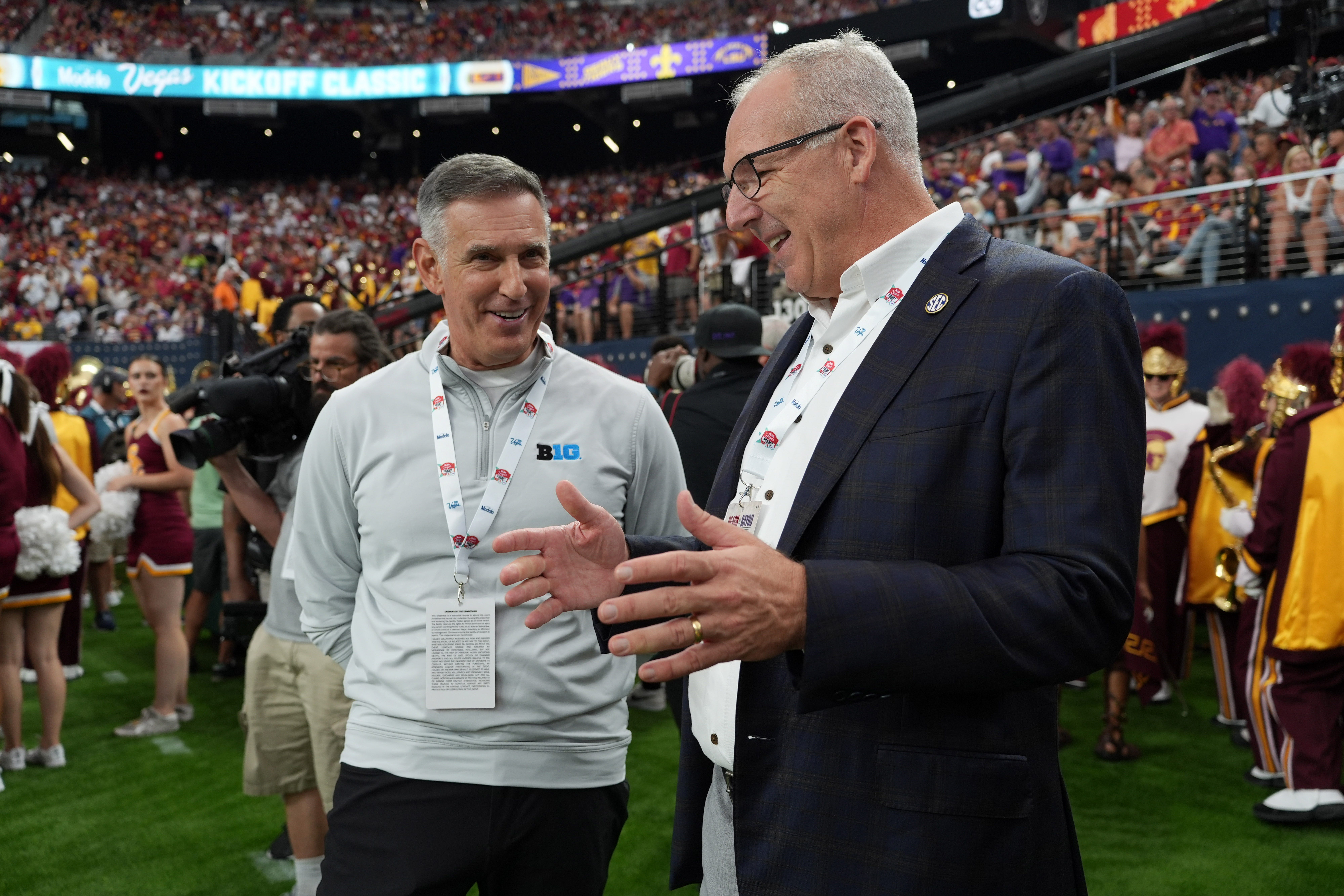 Big Ten commissioner Tony Petitti, left, and SEC commissioner Greg Sankey attend the game between LSU and Southern California at Allegiant Stadium.