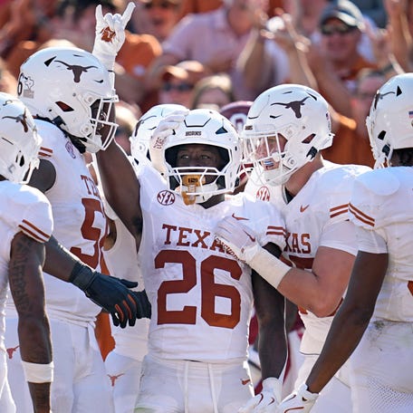 Texas running back Quintrevion Wisner (26) celebrates a touchdown in the first half against Oklahoma at the Cotton Bowl Stadium in Dallas, Texas, Saturday, Oct., 12, 2024.