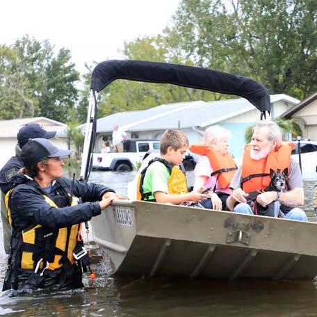 Members of the Volusia County Fire Rescue Special Operations team rescue Florida residents stranded in their homes due to flooding caused by Hurricane Milton in 2024.