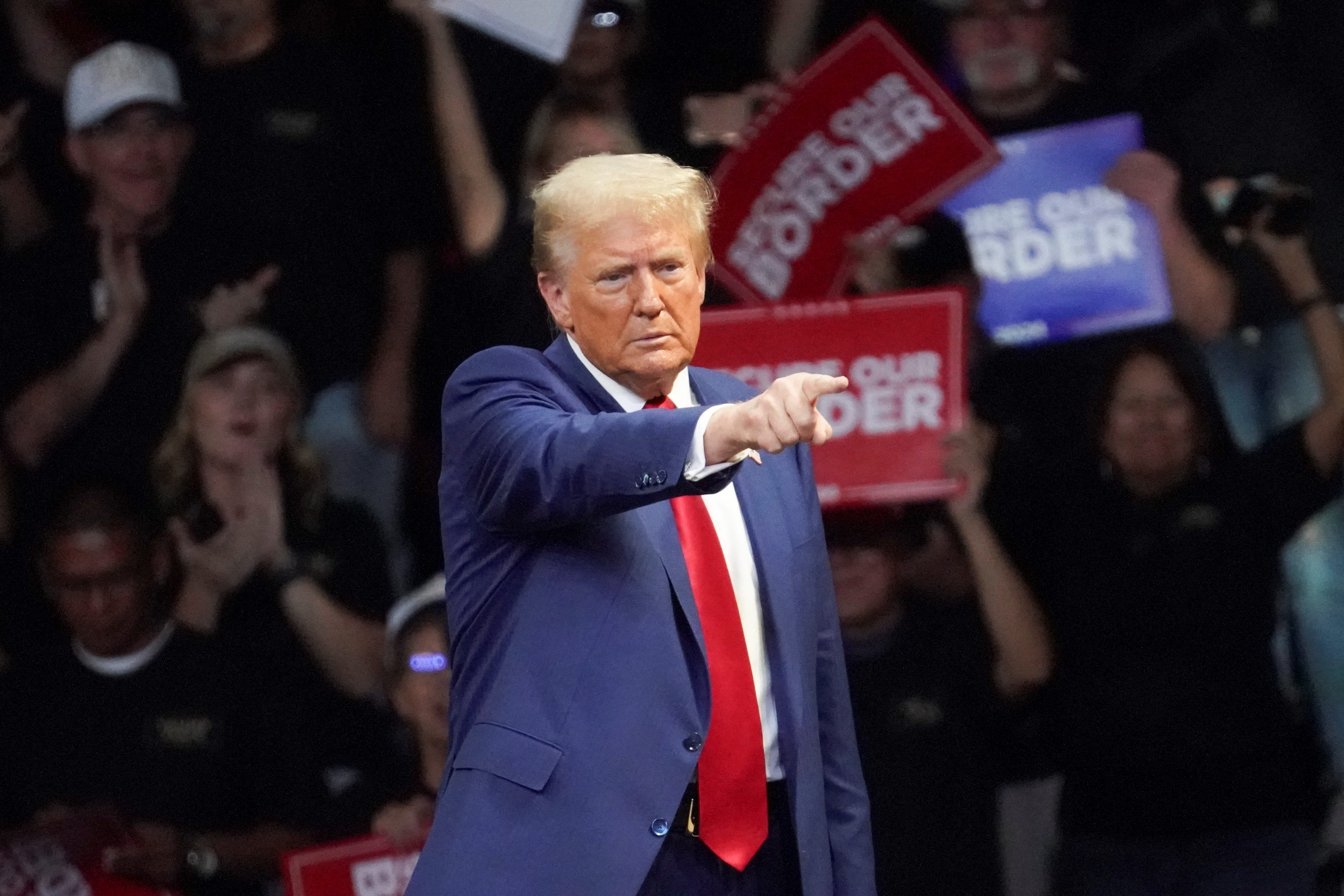 Republican presidential nominee and former U.S. President Donald Trump gestures during a campaign rally in Prescott Valley, Arizona, on Oct. 13, 2024.