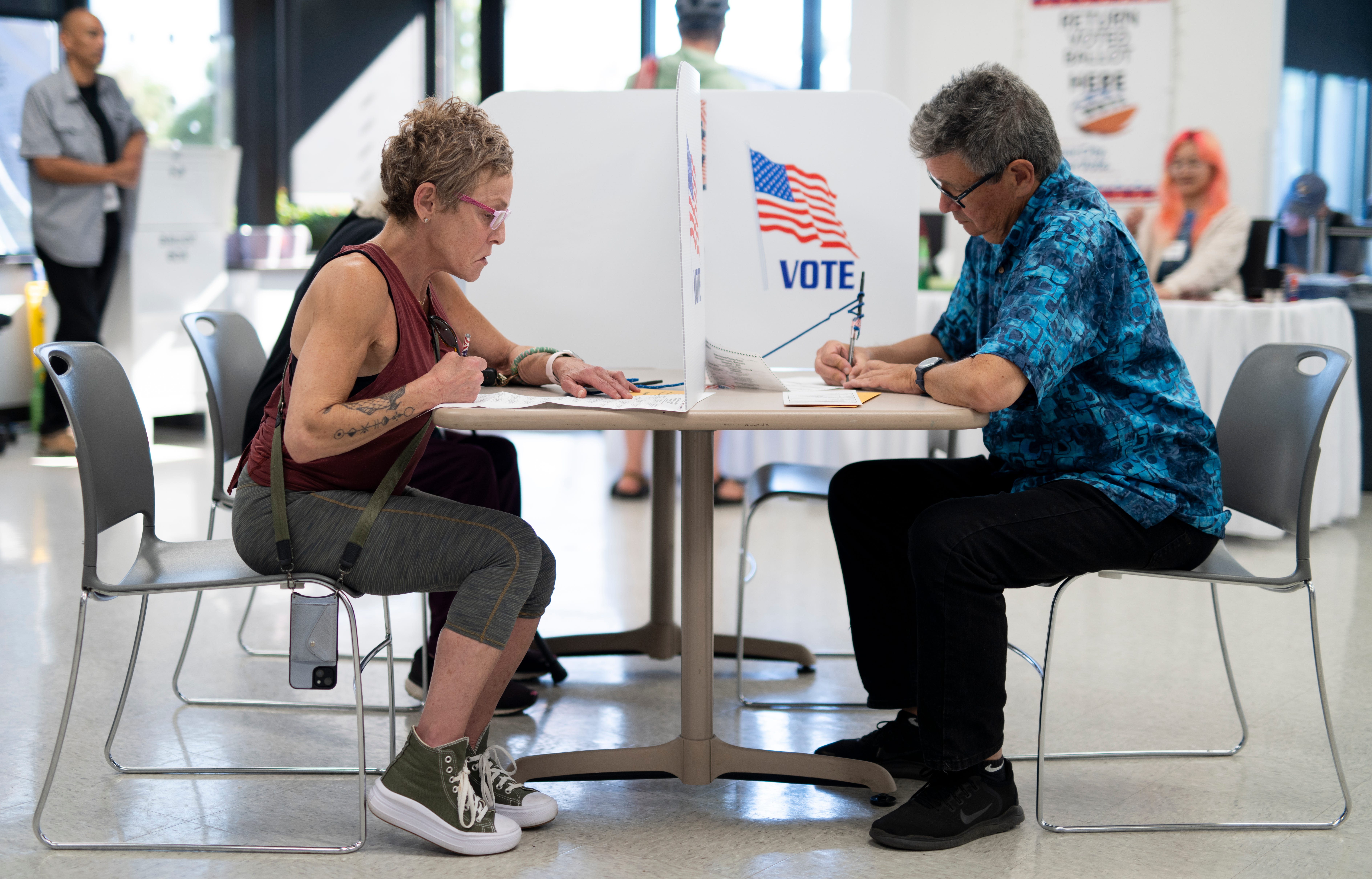 Voters fill out their ballots at the Minneapolis Elections & Voter Services building on Sept. 20, 2024 in Minneapolis.