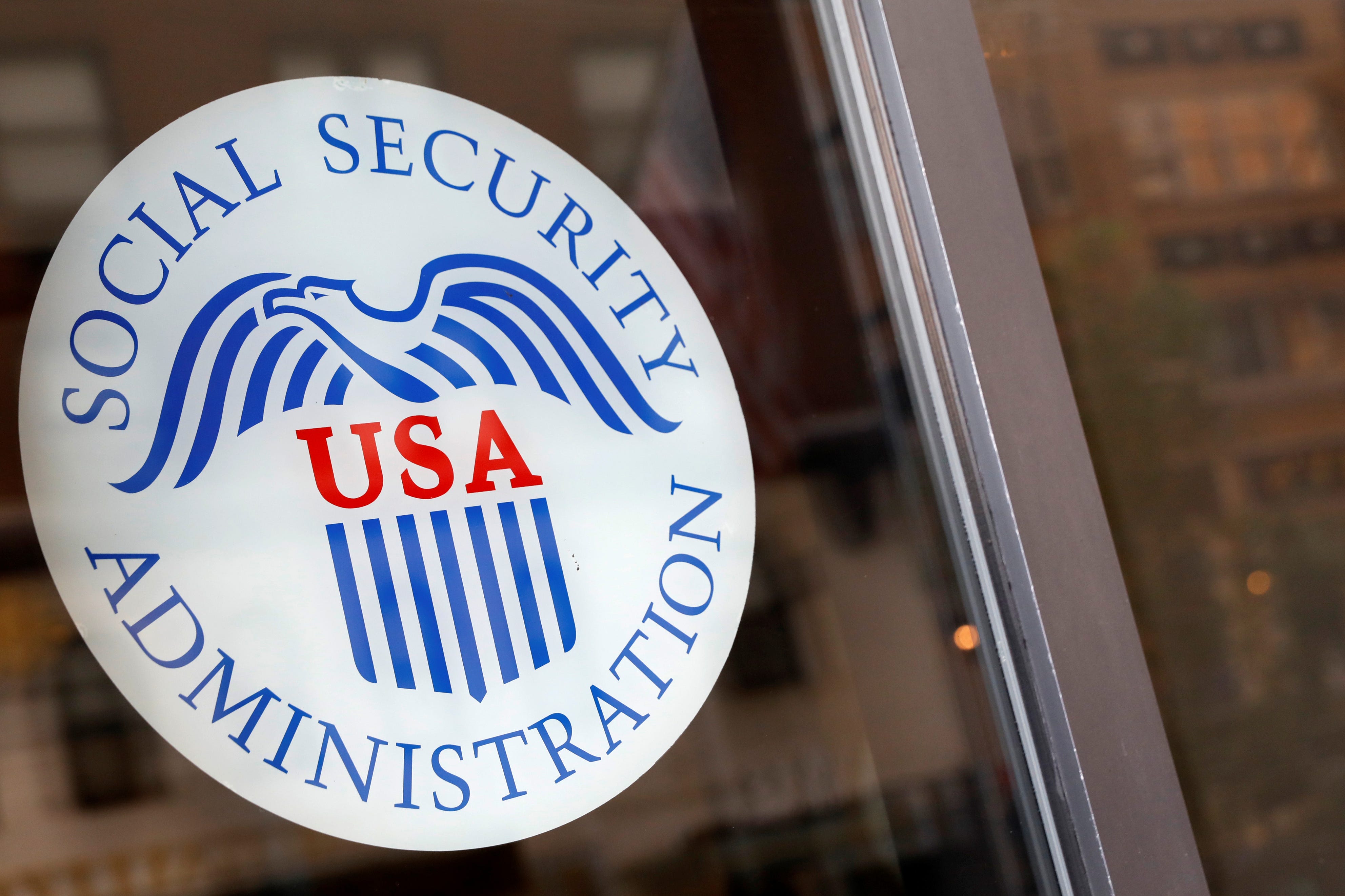 A sign is seen on the entrance to a Social Security office in New York City on July 16, 2018.