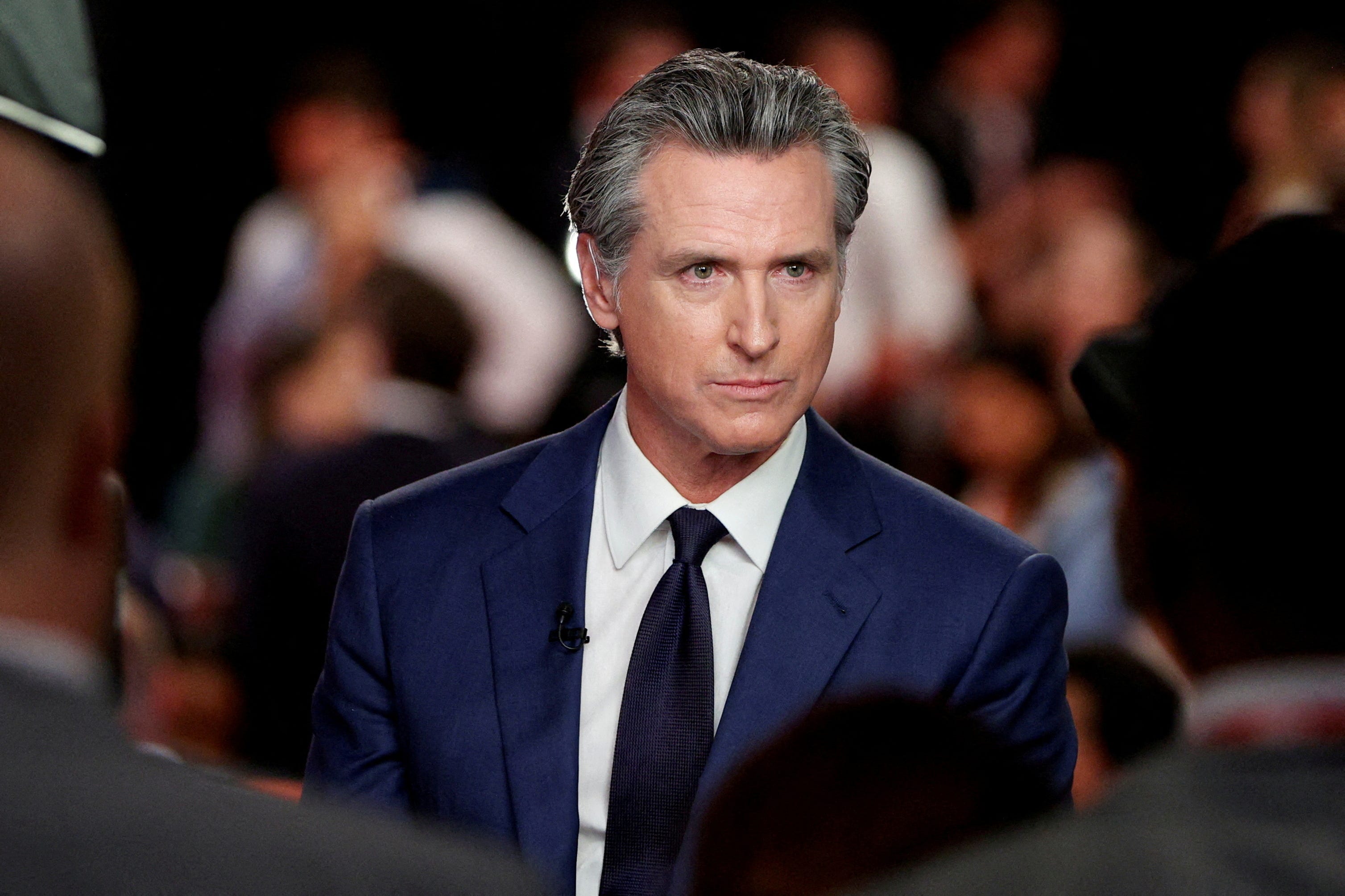 FILE PHOTO: California Governor Gavin Newsom (D) reacts as he speaks to the members of the press on the day of the first presidential debate hosted by CNN in Atlanta, Georgia, U.S., June 27, 2024. REUTERS/Marco Bello/File Photo