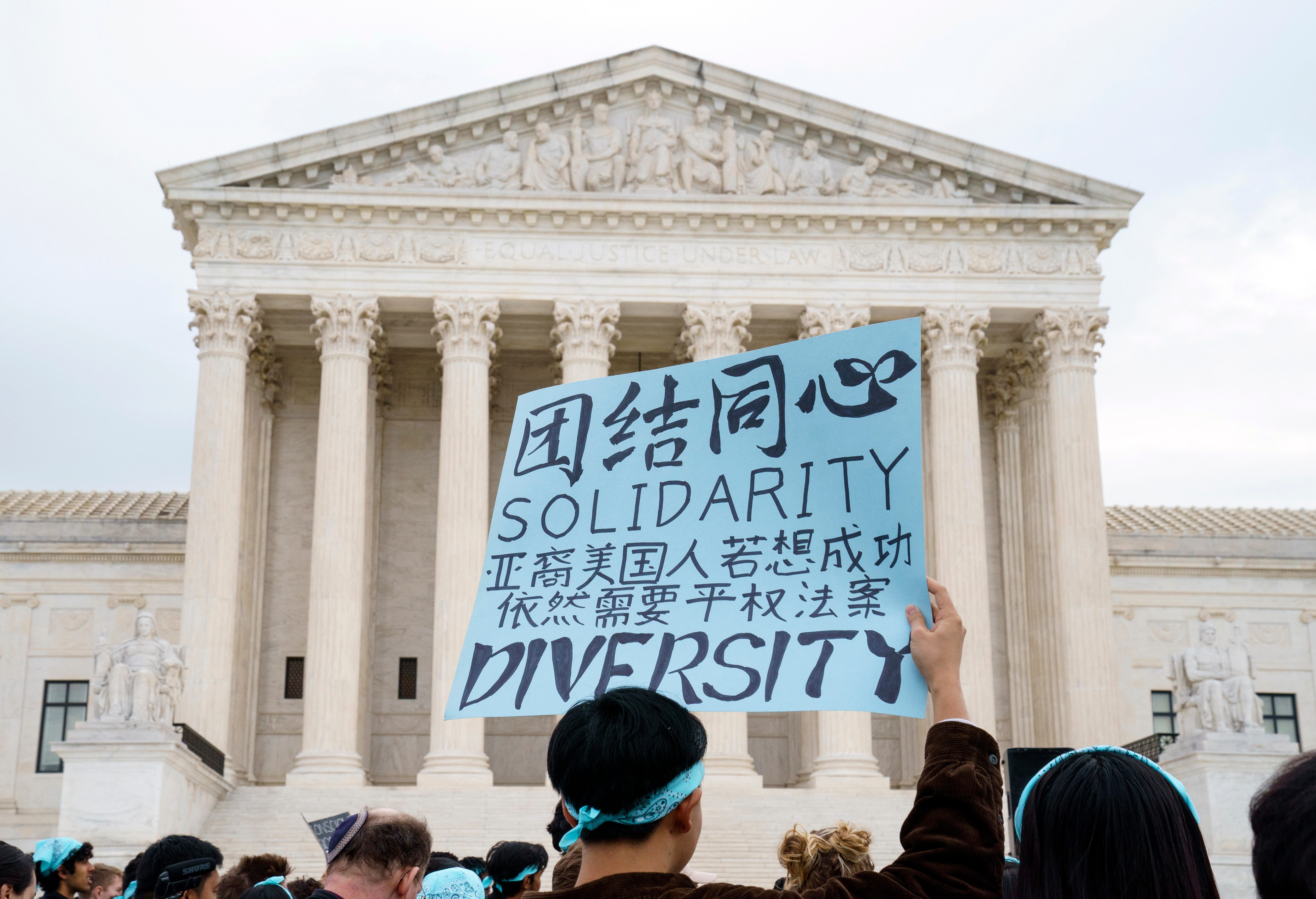 Oct. 31, 2022; Washington, DC, USA. Protestors gather outside as the U.S. Supreme Courts hears oral arguments in two affirmative action college admission cases on October 31, 2022. The two lawsuits from Students for Fair Admissions, an anti-affirmative action group founded by conservative legal strategist Edward Blum, accuse the University of North Carolina and Harvard of discriminating against Asian American students and giving unfair preference to Black and   Hispanic applicants – challenging decades of legal precedent. In the lawsuit against UNC, the group says the school also discriminated against white applicants. Mandatory Credit: Jack Gruber-USA TODAY