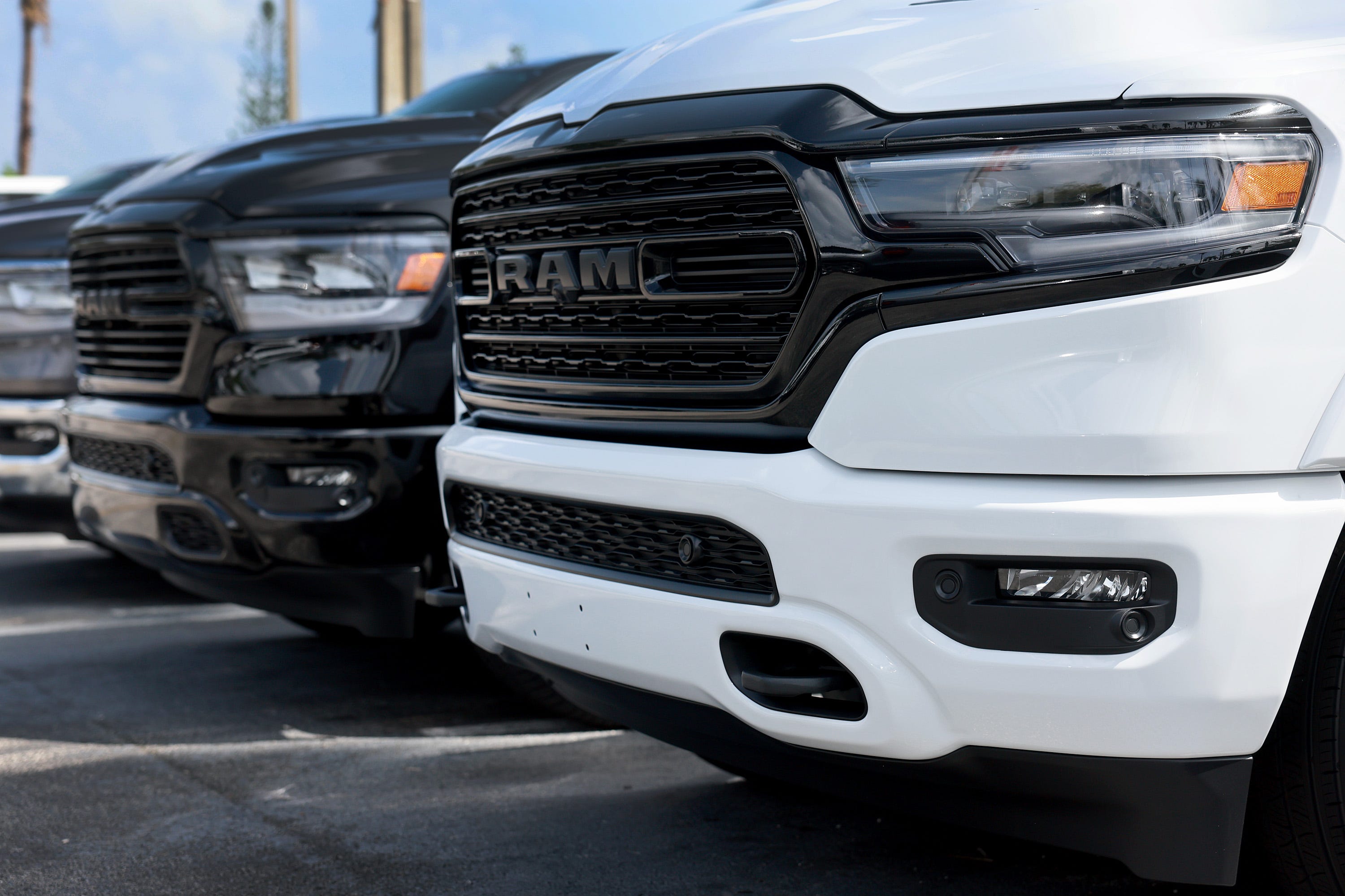 MIAMI, FLORIDA - OCTOBER 03: New Ram vehicles sit on a Dodge Chrysler-Jeep Ram dealership's lot on October 03, 2023 in Miami, Florida. U.S. automakers show a rise in sales in the third quarter even with the ongoing United Auto Workersâ€™ union labor strikes at GM, Ford, and Chrysler-parent Stellantis and higher interest rates. (Photo by Joe Raedle/Getty Images)