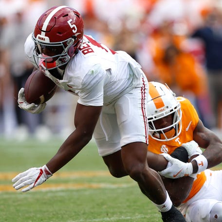 Alabama wide receiver Germie Bernard is tackled by Tennessee defensive back Boo Carter during the second quarter at Neyland Stadium on October 19, 2024 in Knoxville, Tenn.