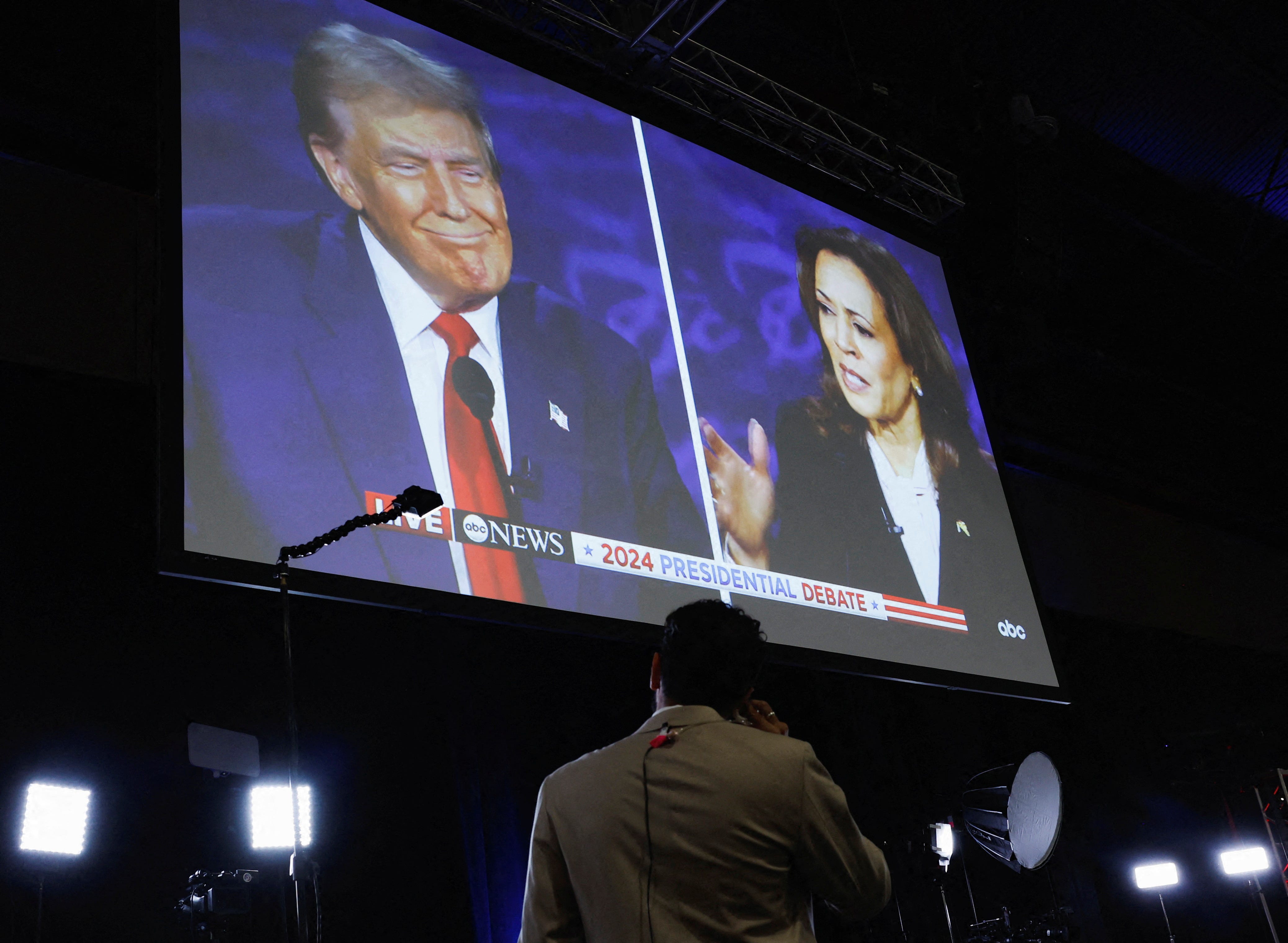 A screen displays the presidential debate hosted by ABC between Republican presidential nominee, former U.S. President Donald Trump and Democratic presidential nominee, U.S. Vice President Kamala Harris in Philadelphia, Pennsylvania, U.S., September 10, 2024. REUTERS/Evelyn Hockstein