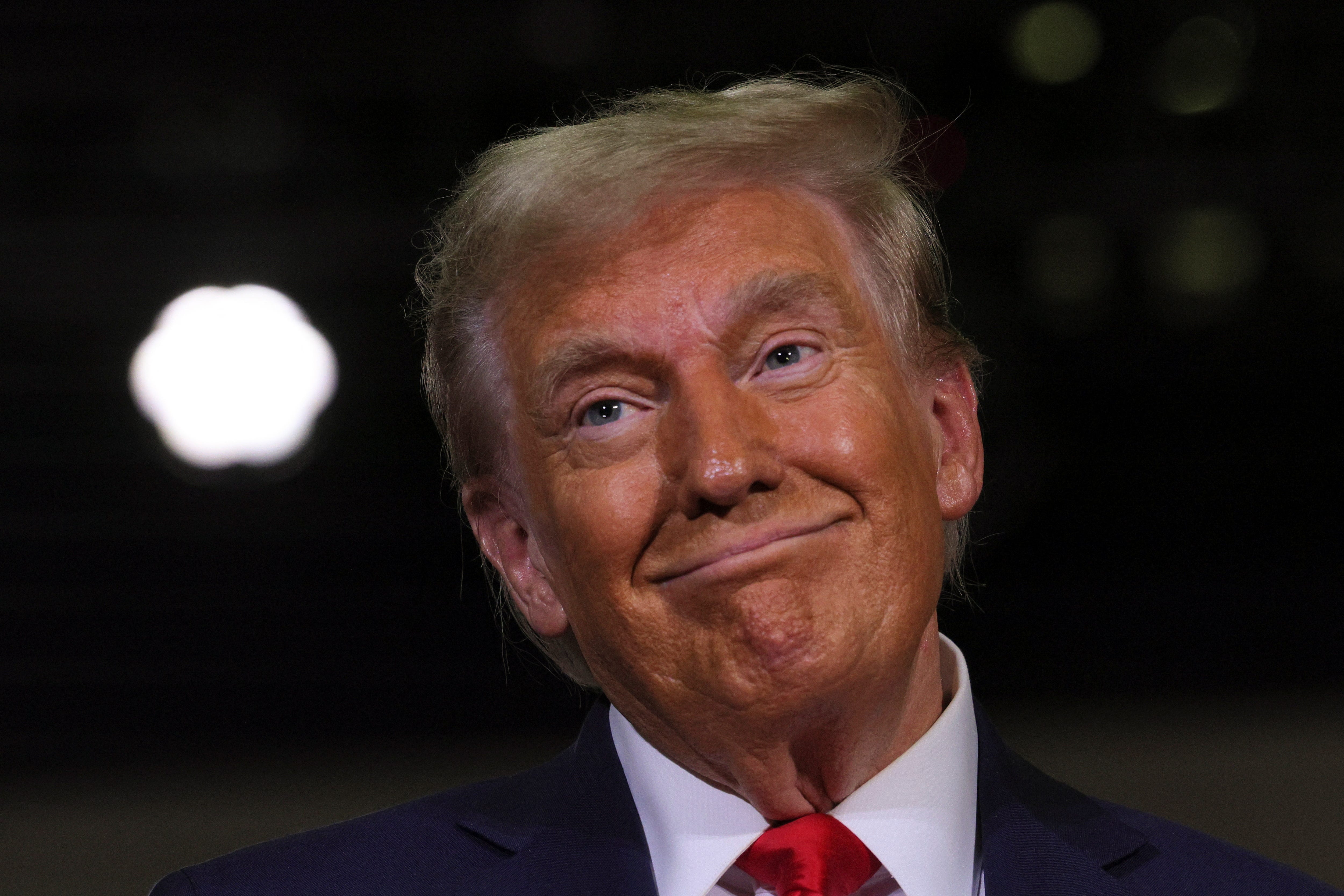Republican presidential nominee and former President Donald Trump reacts during a campaign town hall meeting in Lancaster, Pennsylvania, on Oct. 20, 2024.
