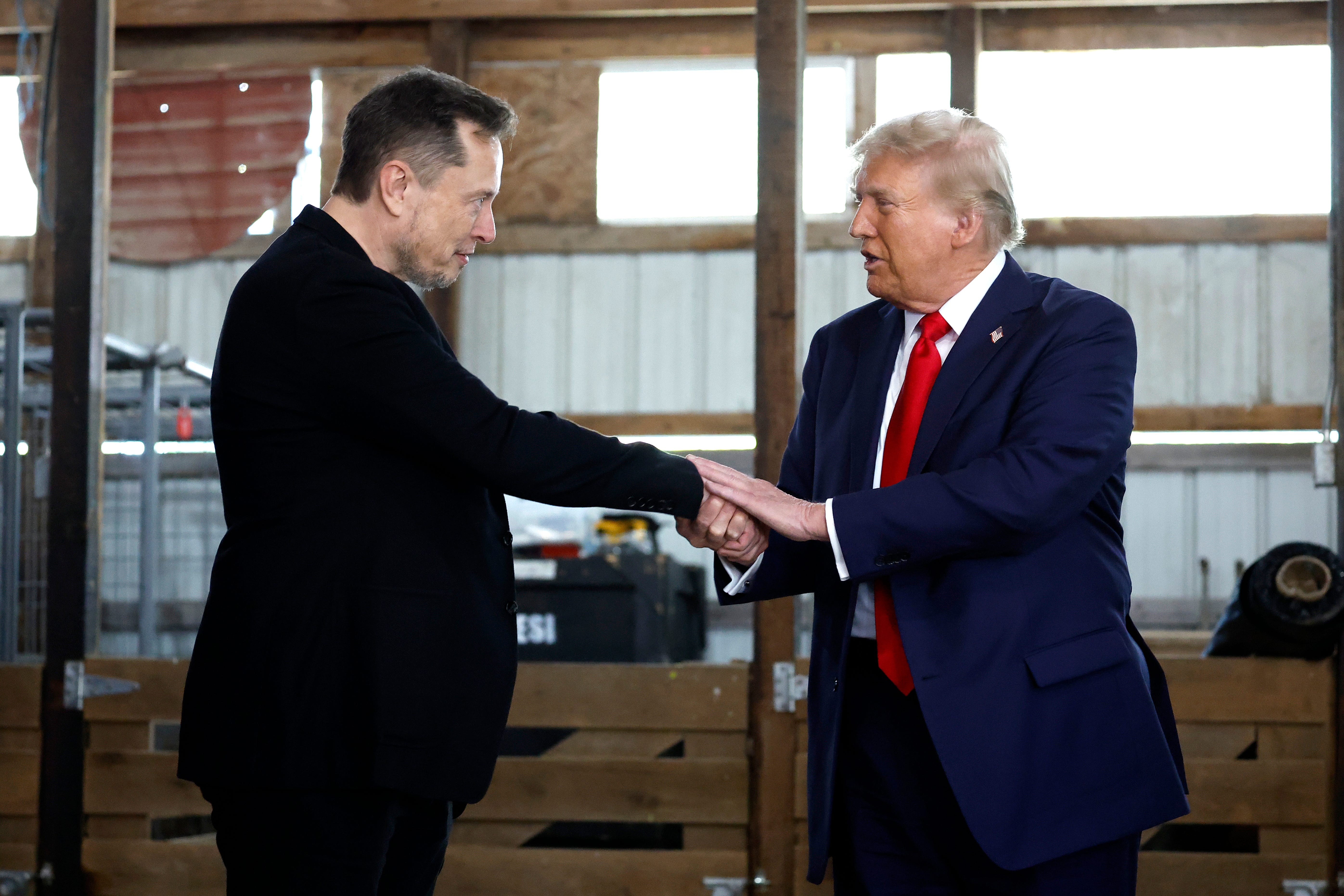 SpaceX CEO Elon Musk greets former President Donald Trump at his reelection campaign rally on Oct. 05, 2024, in Butler, Pa.