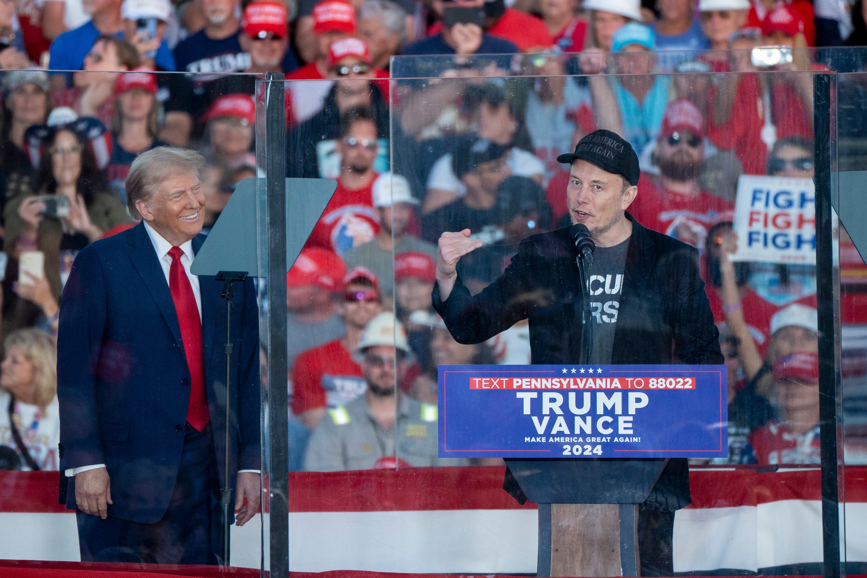 Elon Musk joins former President Donald Trump on stage at a campaign rally in Butler, Pa., on Oct. 5, 2024.