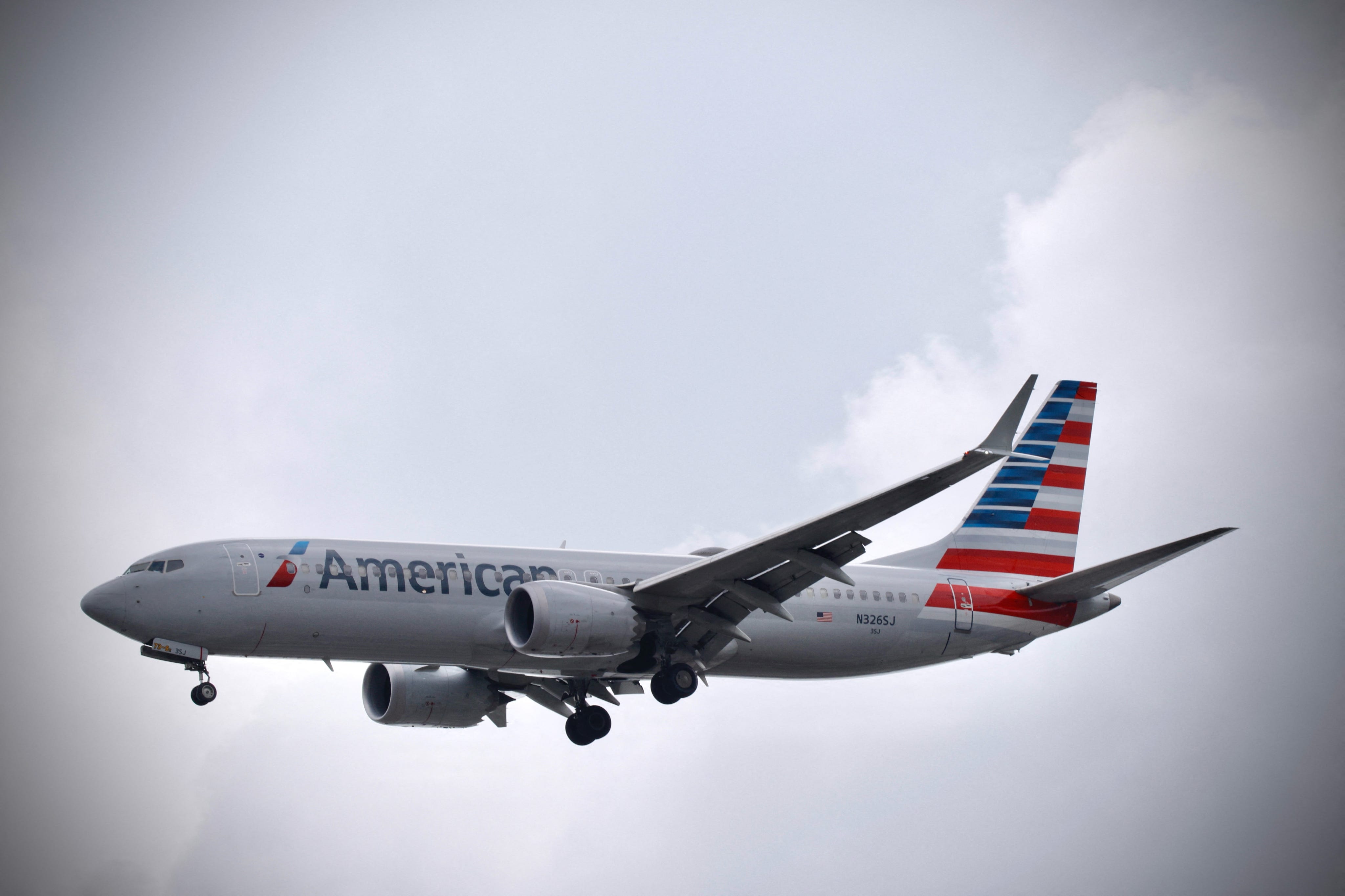 An American Airlines plane lands at La Guardia International Airport one day after a global IT outage, in New York, on July 20, 2024. Planes were gradually taking off again Saturday after global airlines, banks and media were thrown into turmoil by one of the biggest IT crashes in recent years, caused by an update to an antivirus program. Passenger crowds had swelled at airports on July 19 as dozens of flights were cancelled after an update to a program operating on   Microsoft Windows crashed systems worldwide.
