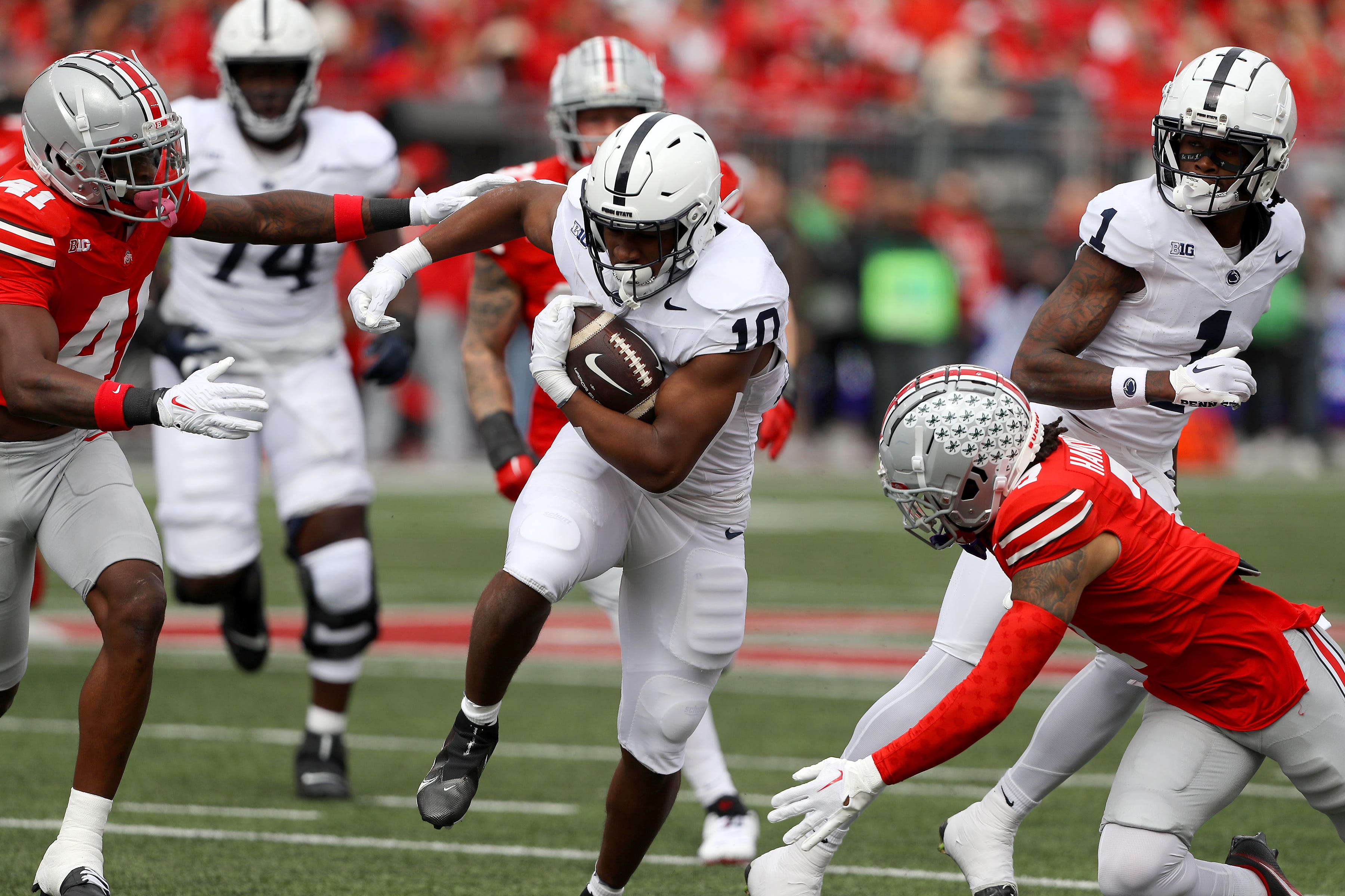 Penn State running back Nicholas Singleton (10) runs the ball against Ohio State during their 2023 game at Ohio Stadium.
