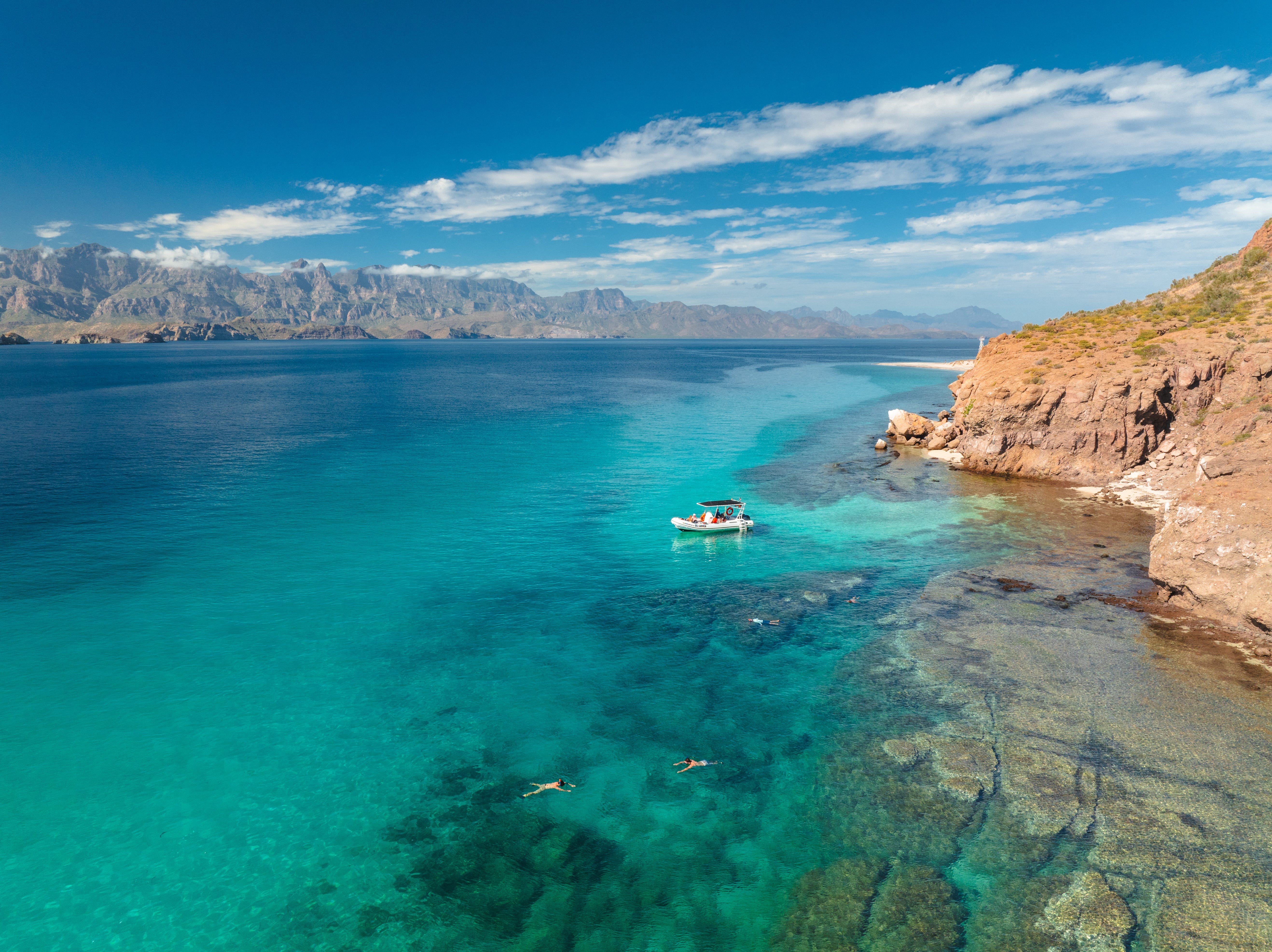 Travelers can explore the national park by boat tour, snorkeling or scuba diving.