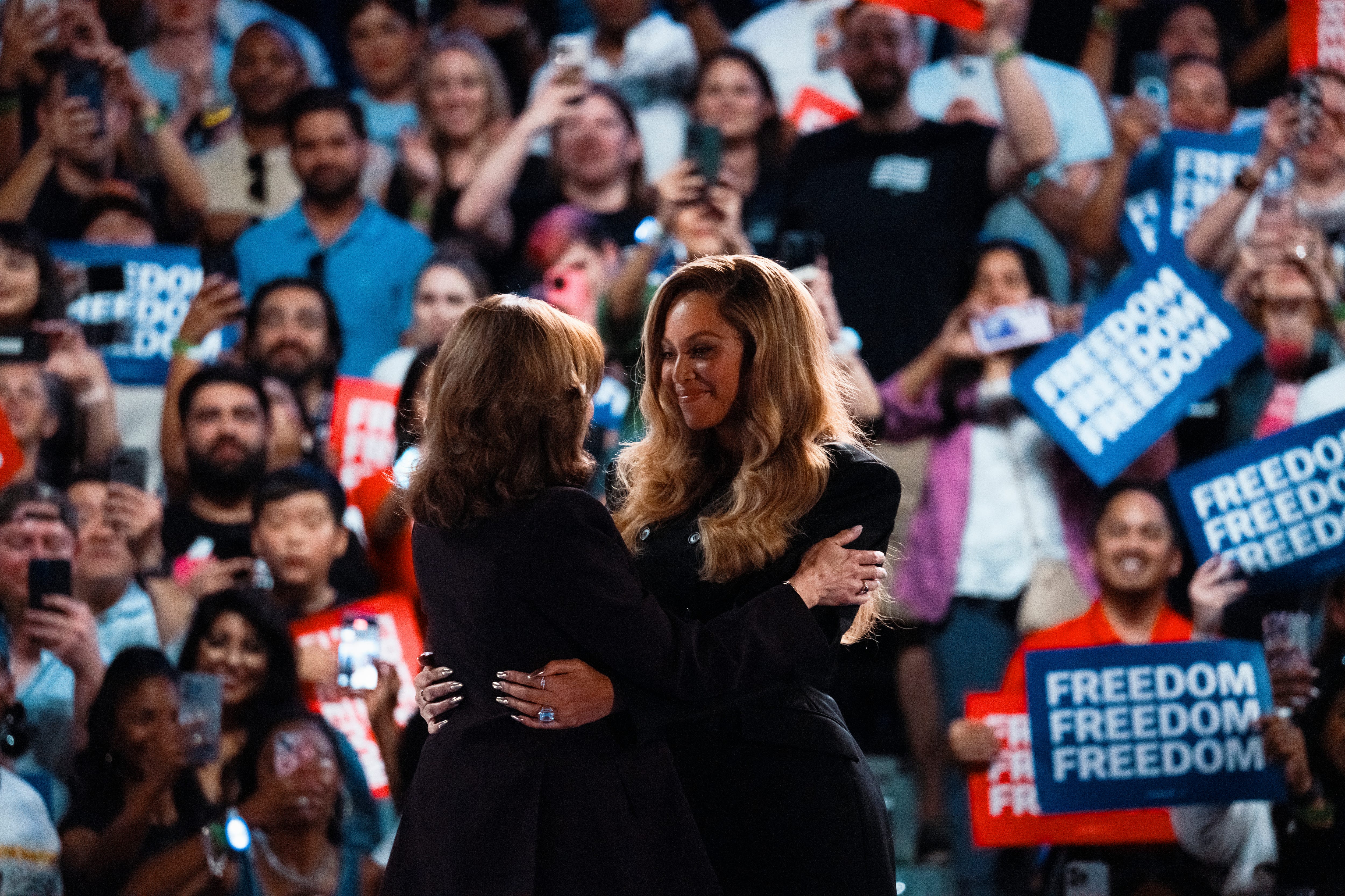 Democratic presidential nominee Kamala Harris embraces superstar Beyoncé at a campaign rally on Oct. 25, 2024, in Houston. "I'm not here as a celebrity. I'm not here as a politician," Beyoncé said in endorsing Harris. "I'm here as a mother, a mother who cares about the world our children live in, a world where we have the freedom to control our bodies, a world where we are not divided, our past or present or future."