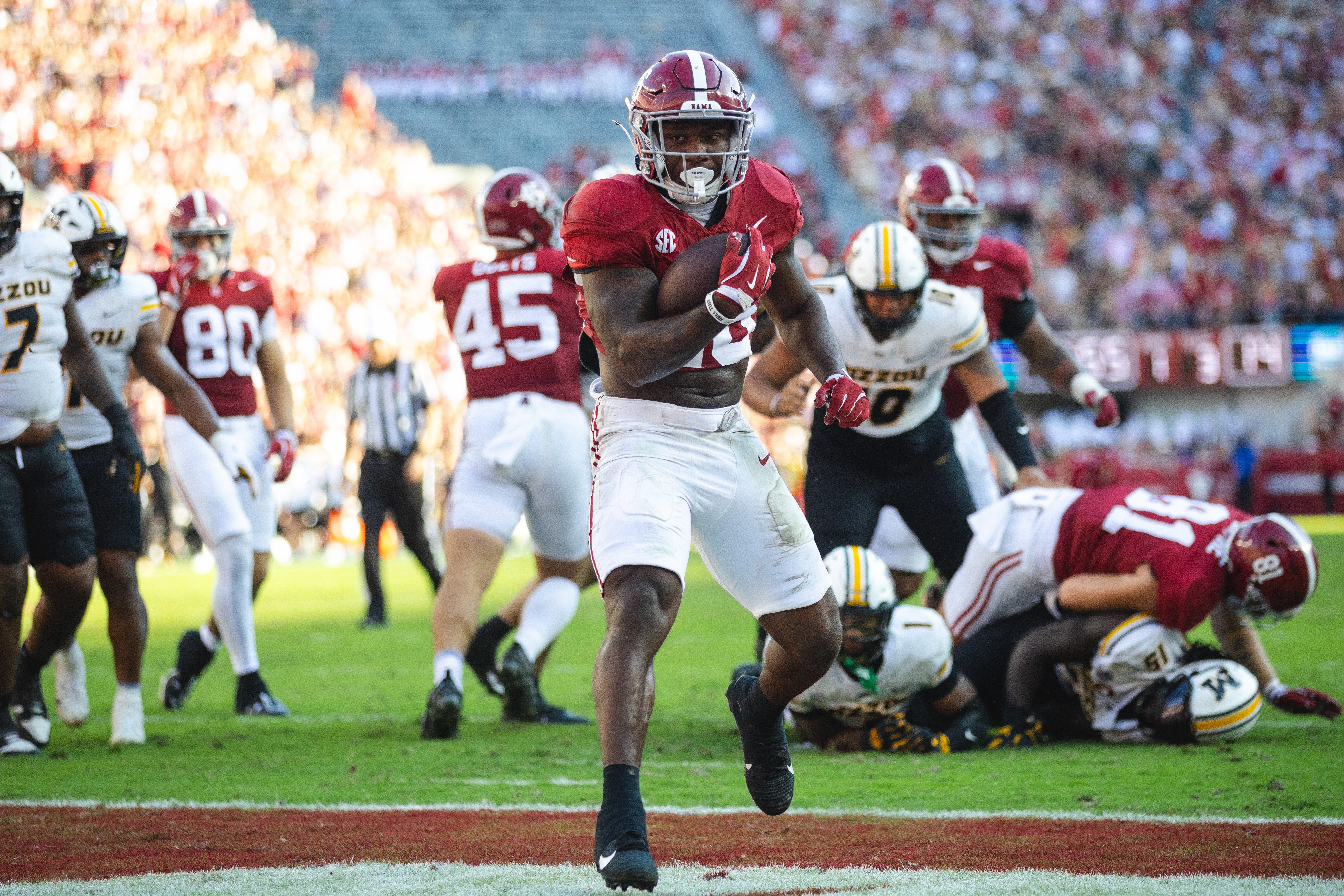 Alabama running back Jam Miller (26) scores a touchdown against Missouri during the second quarter at Bryant-Denny Stadium.