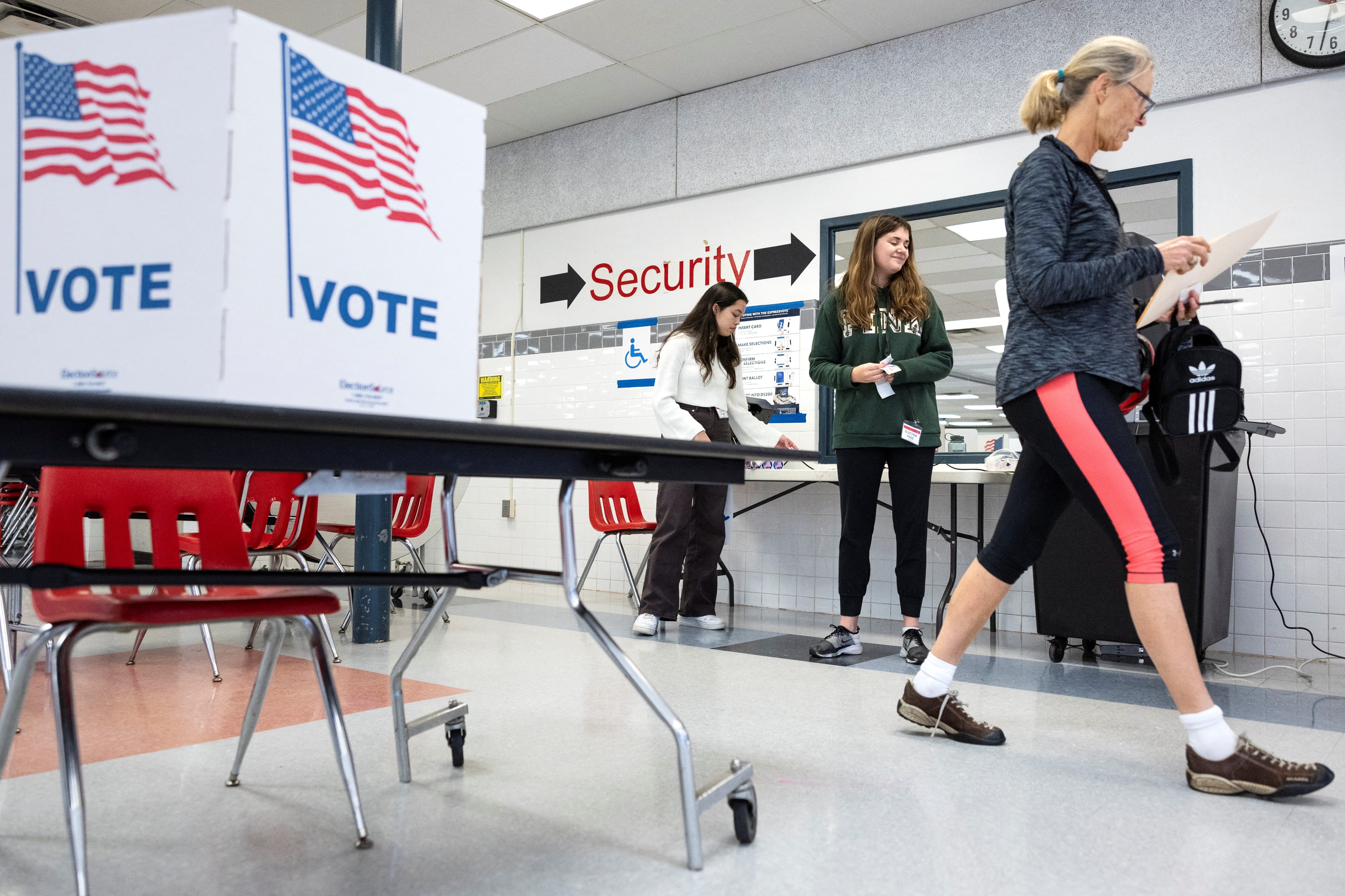 First time voter Alexandra Hall exits the polls after casting her vote at McLean High School on Election Day in McLean, Virginia, on Nov. 8, 2022.