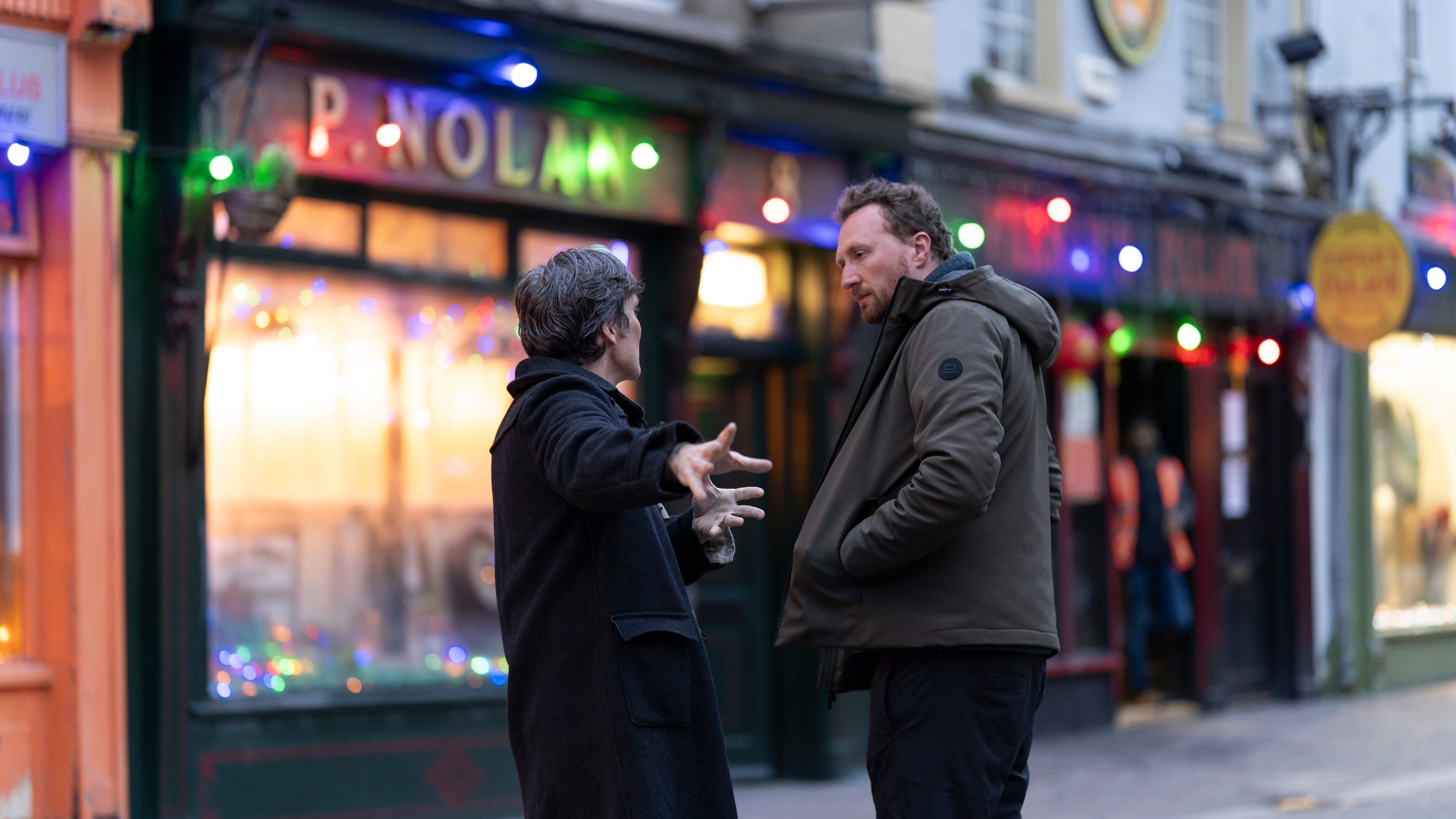 Cillian Murphy confers with director Tim Mielants on the set of "Small Things Like These."