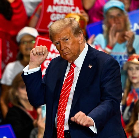 Republican presidential nominee Donald Trump dances as he leaves a reelection campaign rally in Rocky Mount, North Carolina, in 2024.