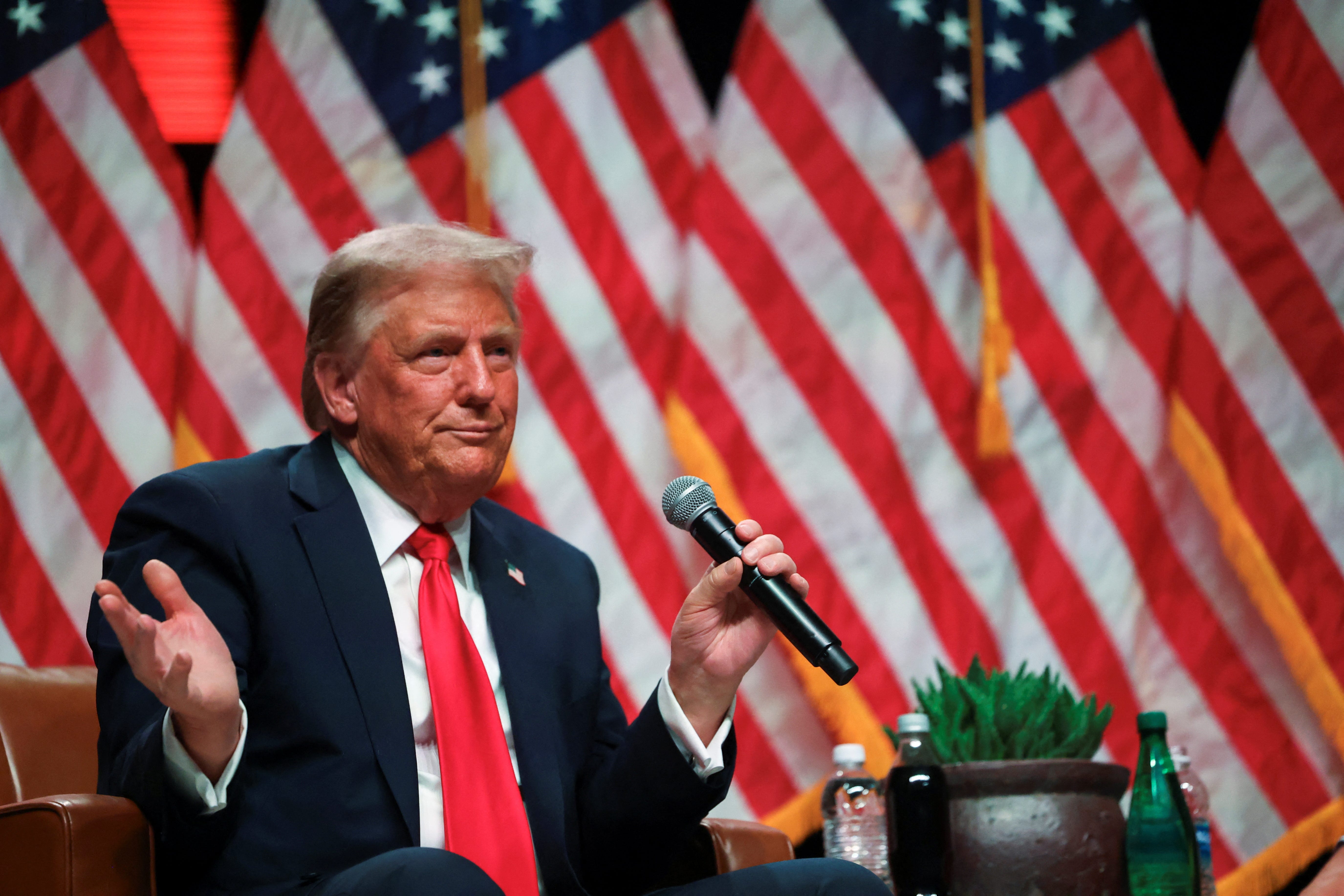 Republican presidential nominee and former President Donald Trump participates in a fireside chat with Tucker Carlson at 'Tucker Carlson Live on Tour' at Desert Diamond Arena, in Glendale, Arizona, on Oct. 31, 2024.