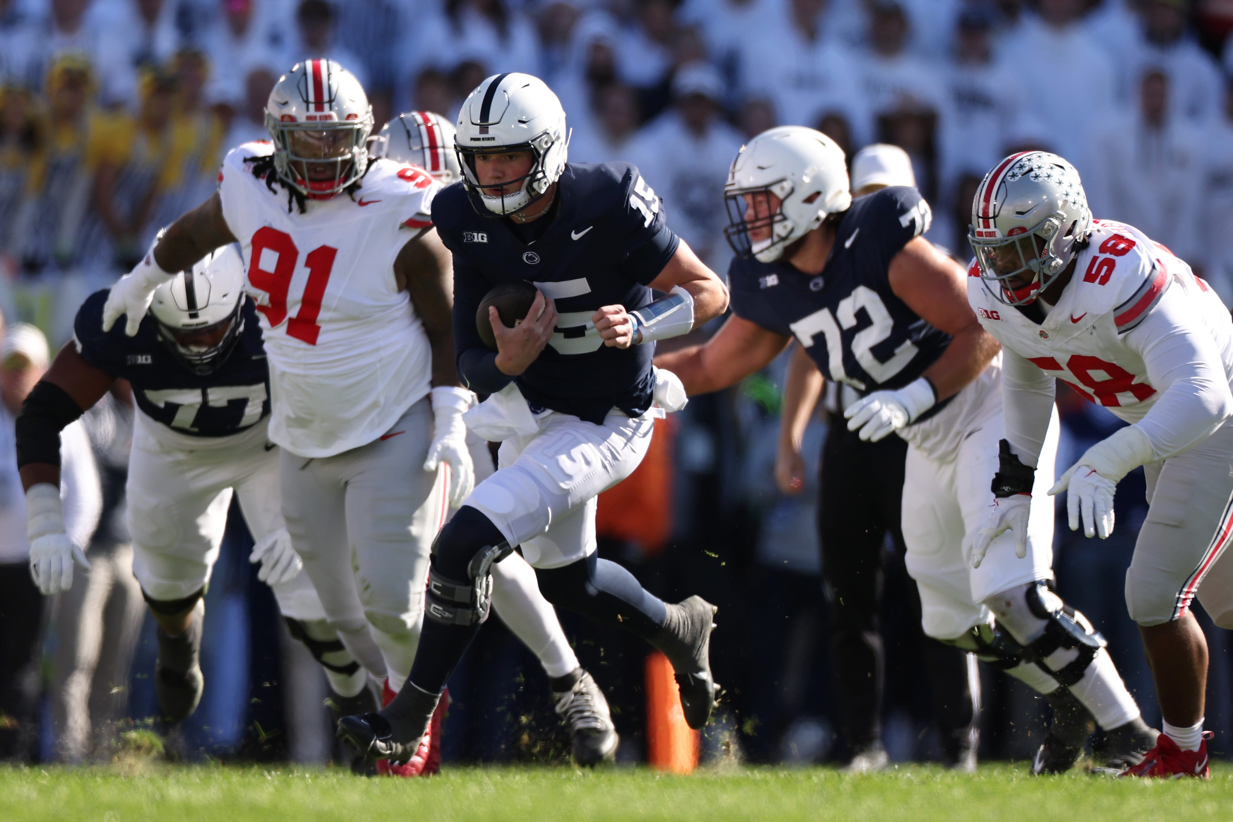 Penn State quarterback Drew Allar runs the ball for a first down against Ohio State during their game at Beaver Stadium on November 02, 2024 in State College, Pennsylvania.