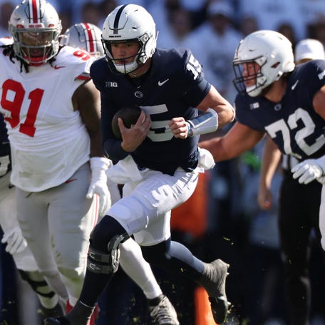 Penn State quarterback Drew Allar runs the ball for a first down against Ohio State during their game at Beaver Stadium on November 02, 2024 in State College, Pennsylvania.
