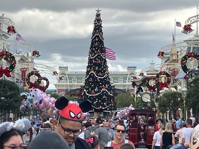 Just like, well, magic: It's Christmas at Walt Disney World's Magic Kingdom. From the towering tree to lined lampposts to festive wreaths (some shaped like mouse ears!) holiday decorations now soar along with spirits as people crowd onto Main Street U.S.A. and beyond.