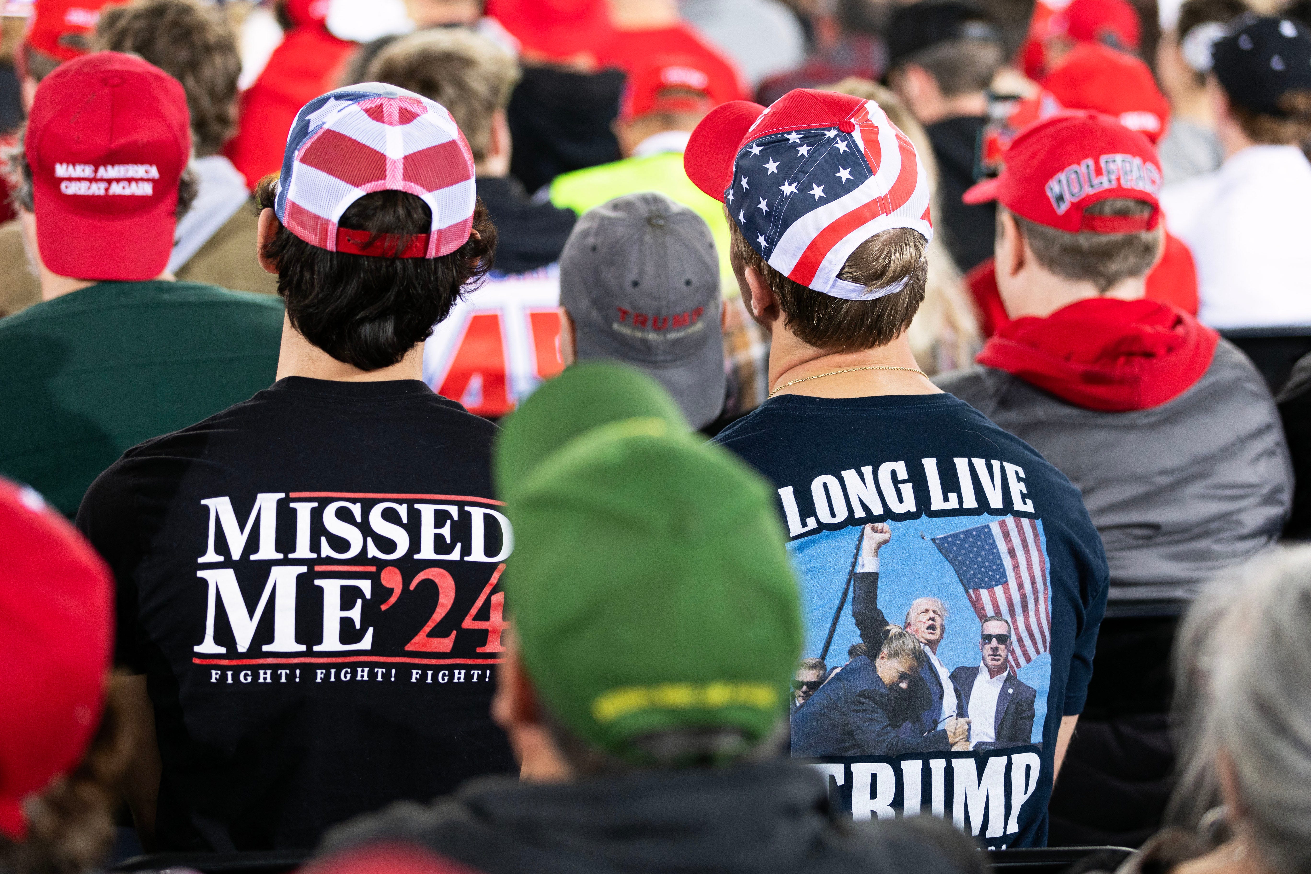 Supporters watch former President Donald Trump campaign for reelection in Raleigh, N.C., on Nov. 4, 2024.