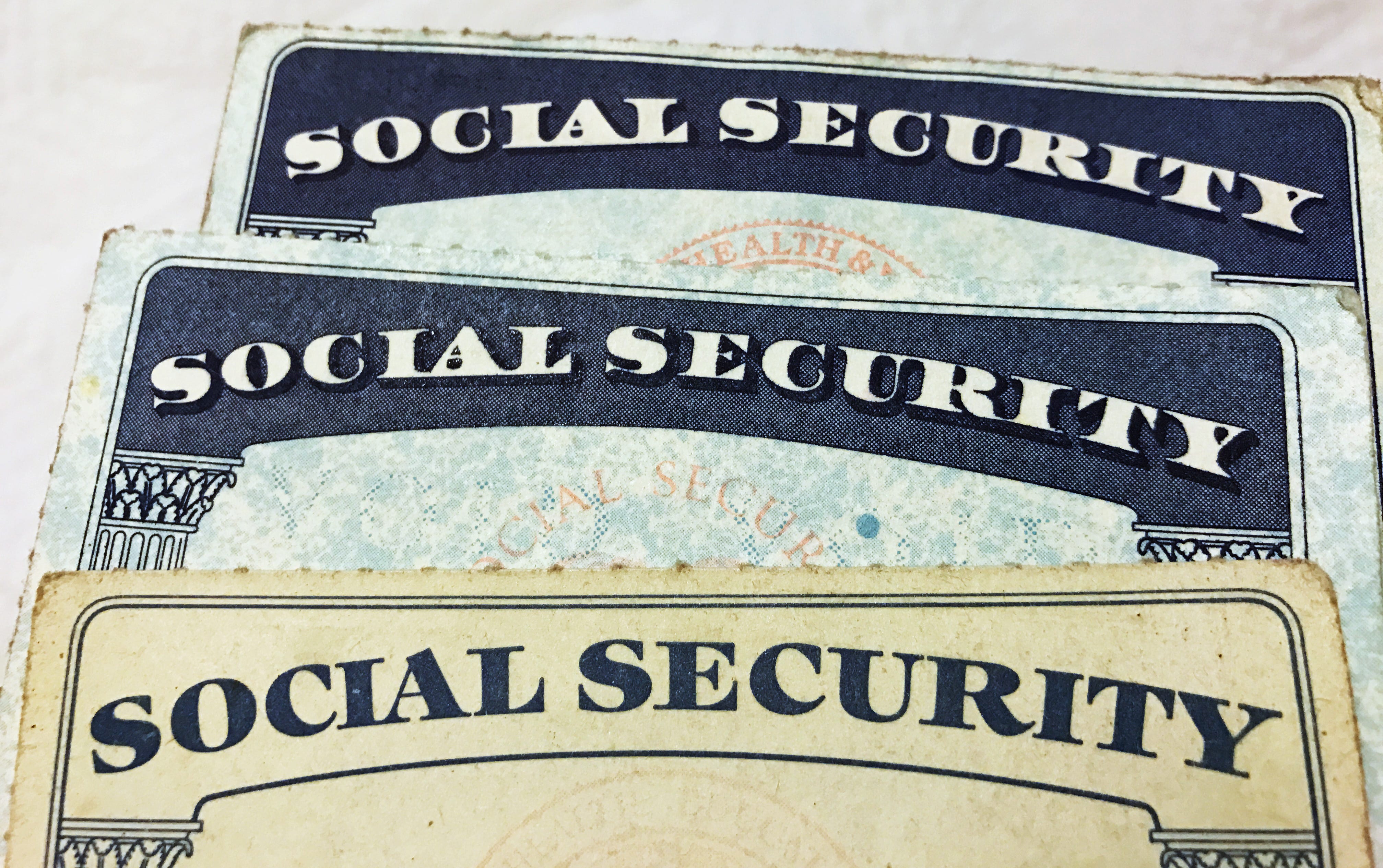 U.S. Social Security card designs over the past several decades are shown in this photo illustration in 2017.