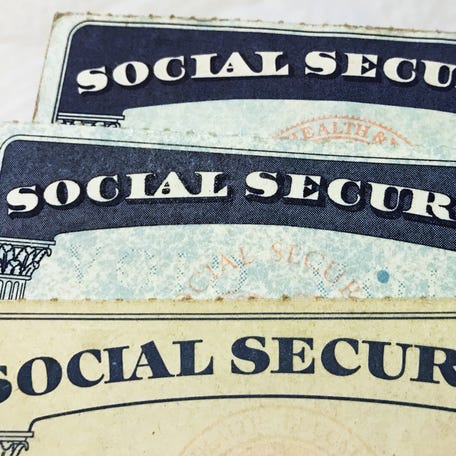 U.S. Social Security card designs over the past several decades are shown in this photo illustration in 2017.