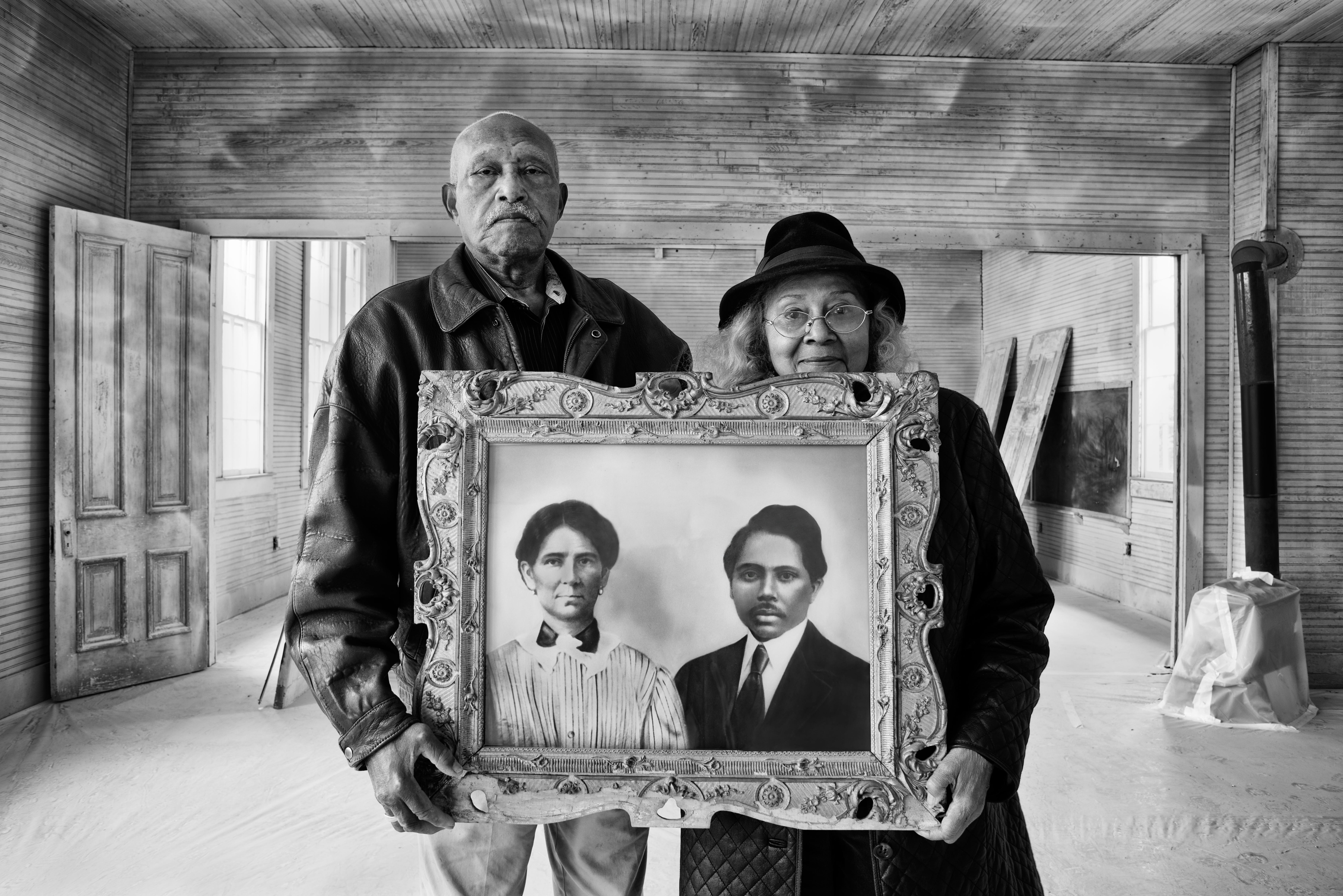 Elroy and Sophia Williams at the Hopewell School, a Rosenwald School at Cedar Creek in Bastrop County. Sophia's formerly enslaved grandparents, Sophia Veal and Martin McDonald, shown in a portrait from the 1920s, acquired and donated the land for the school. This photo is part of an exhibit about the Rosenwald School movement at the Bullock Texas State History Museum.