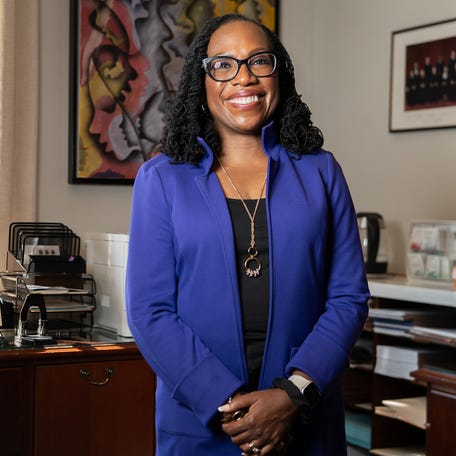 Sep 20, 2024; Washington, D.C., U.S. Supreme Court Justice Ketanji Brown Jackson poses in front of a a portrait by Lonnie Holley titled 