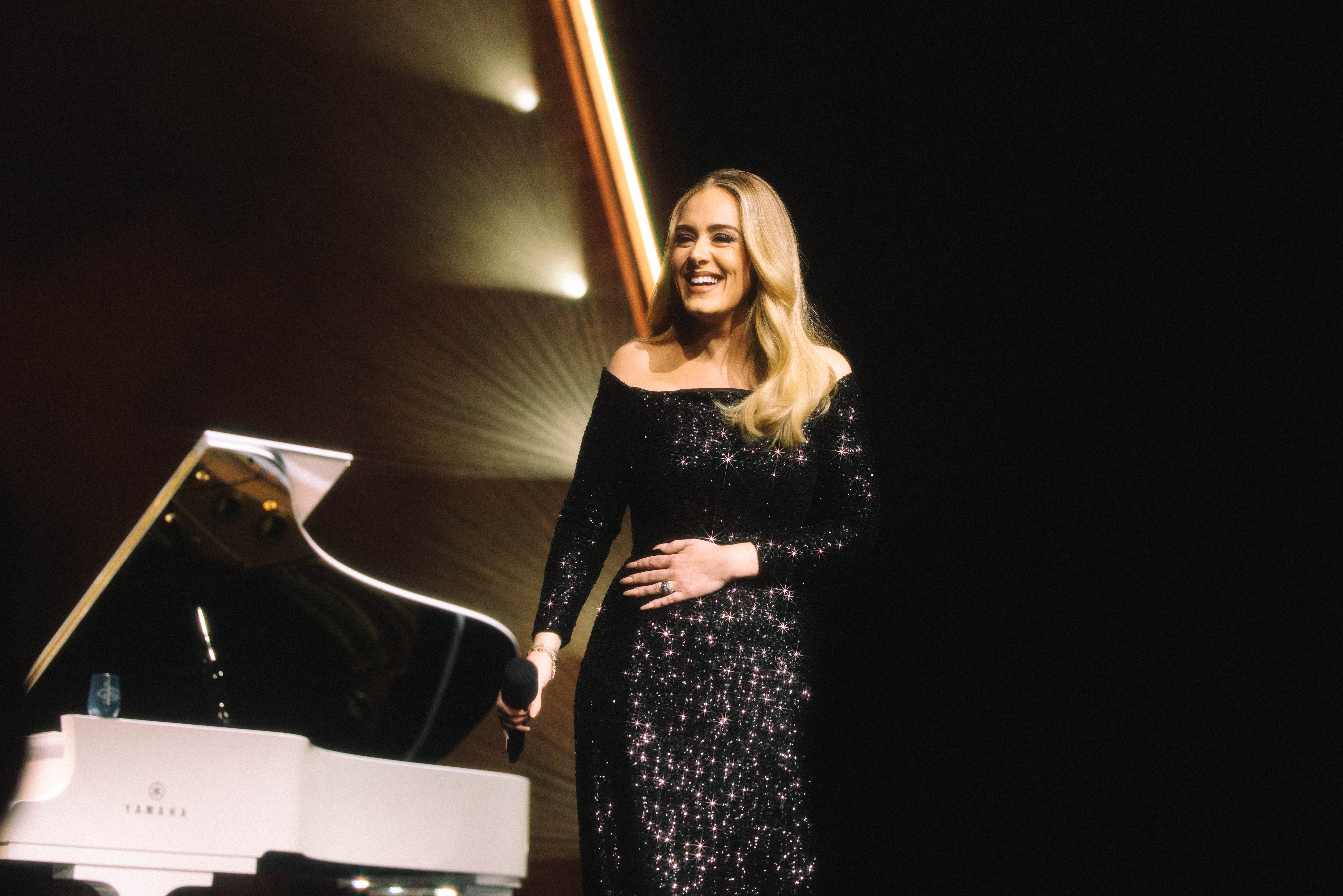 Adele's Las Vegas residency show starts quietly, with the singer and her pianist, but unfurls into a staggering production.
