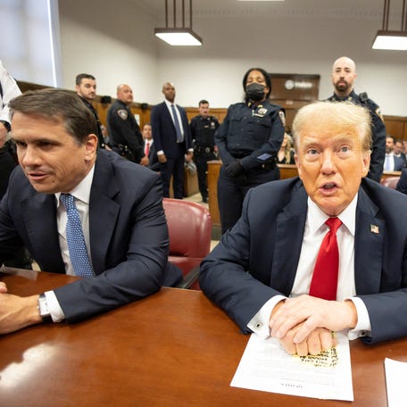 Former U.S. President Donald Trump sits at the defendant's table with his attorneys Todd Blanche and Emil Bove during his criminal trial at New York State Supreme Court in New York, U.S., May 28, 2024.