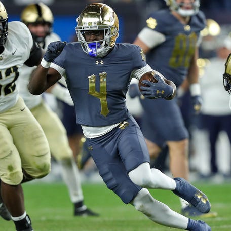 Notre Dame running back Jeremiyah Love (4) runs with the ball against Army during the first half at Yankee Stadium.