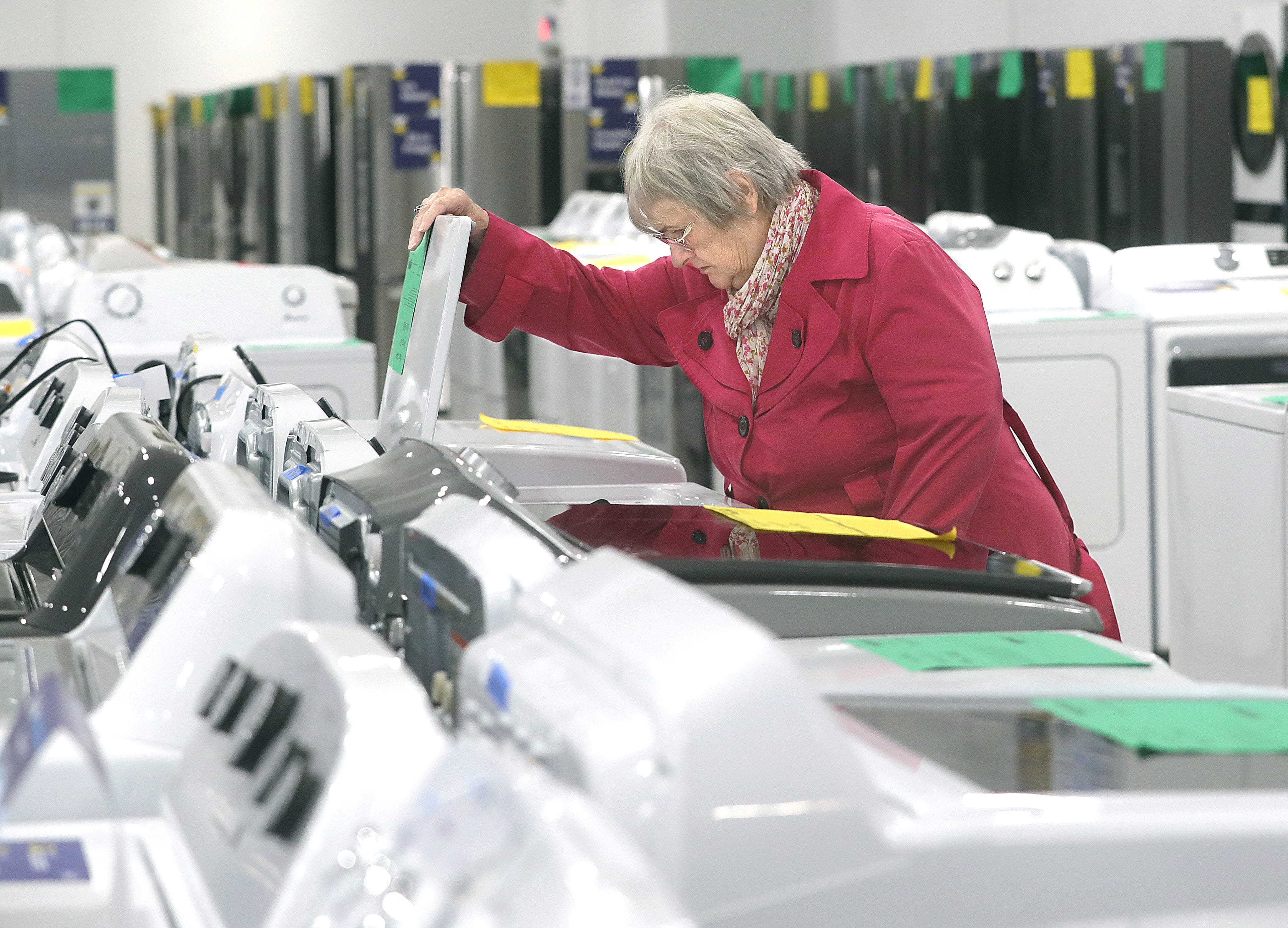 Joan Fedelischak of Streetsboro shops for a washing machine at the new Lowe's Outlet on Tuesday, Oct. 17, 2023, in Cuyahoga Falls, Ohio, in the Chapel Hill Plaza. [Phil Masturzo/ Beacon Journal]